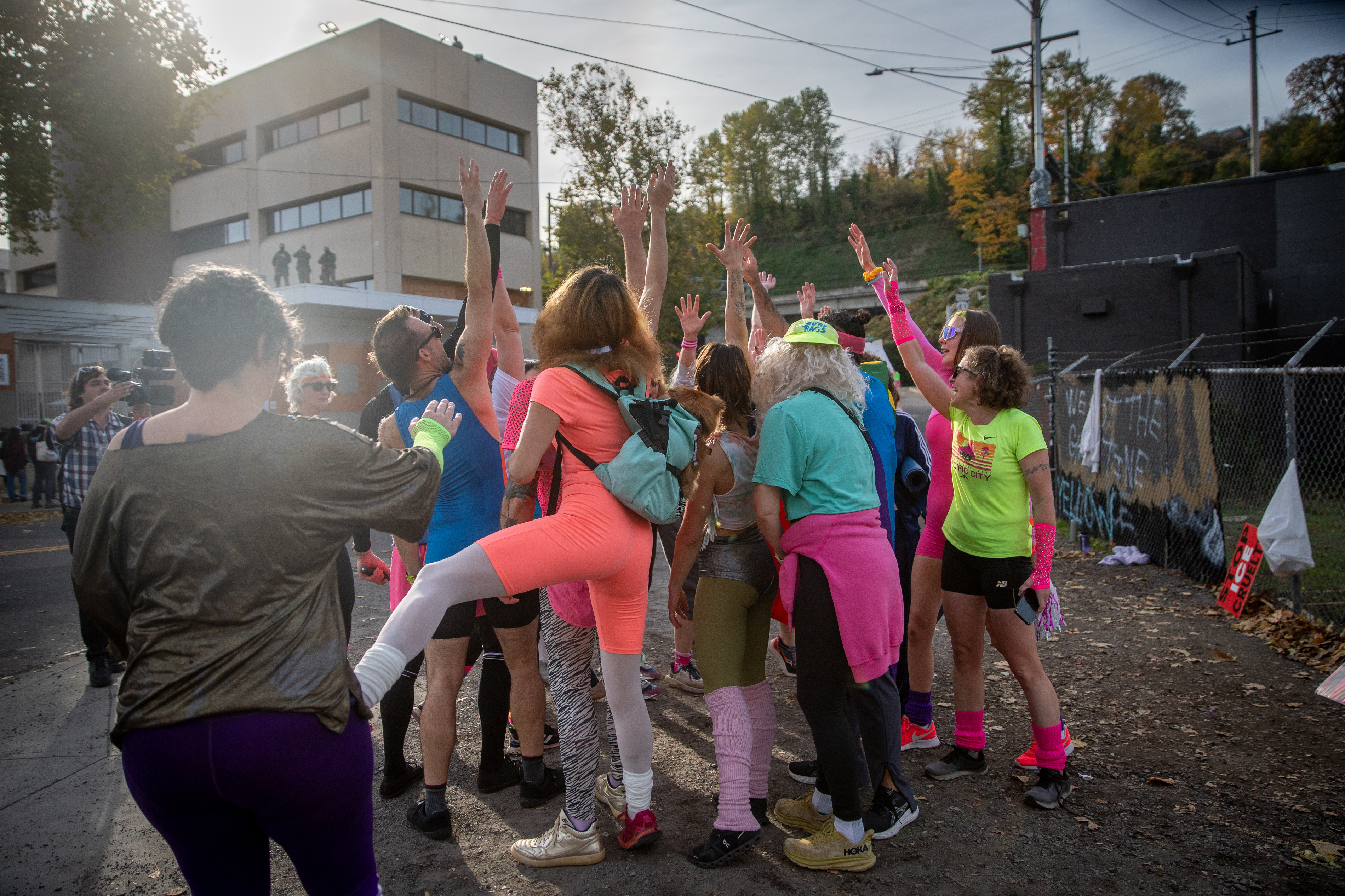 Participants in Fulcrum Fitness’s “Sweatin’ Out the Fascists” held an ’80s-aerobics peaceful protest outside the U.S. Immigration and Customs Enforcement (ICE) facility in South Portland on Sunday, Nov. 9, 2025, collecting donations for the Oregon Food Bank.