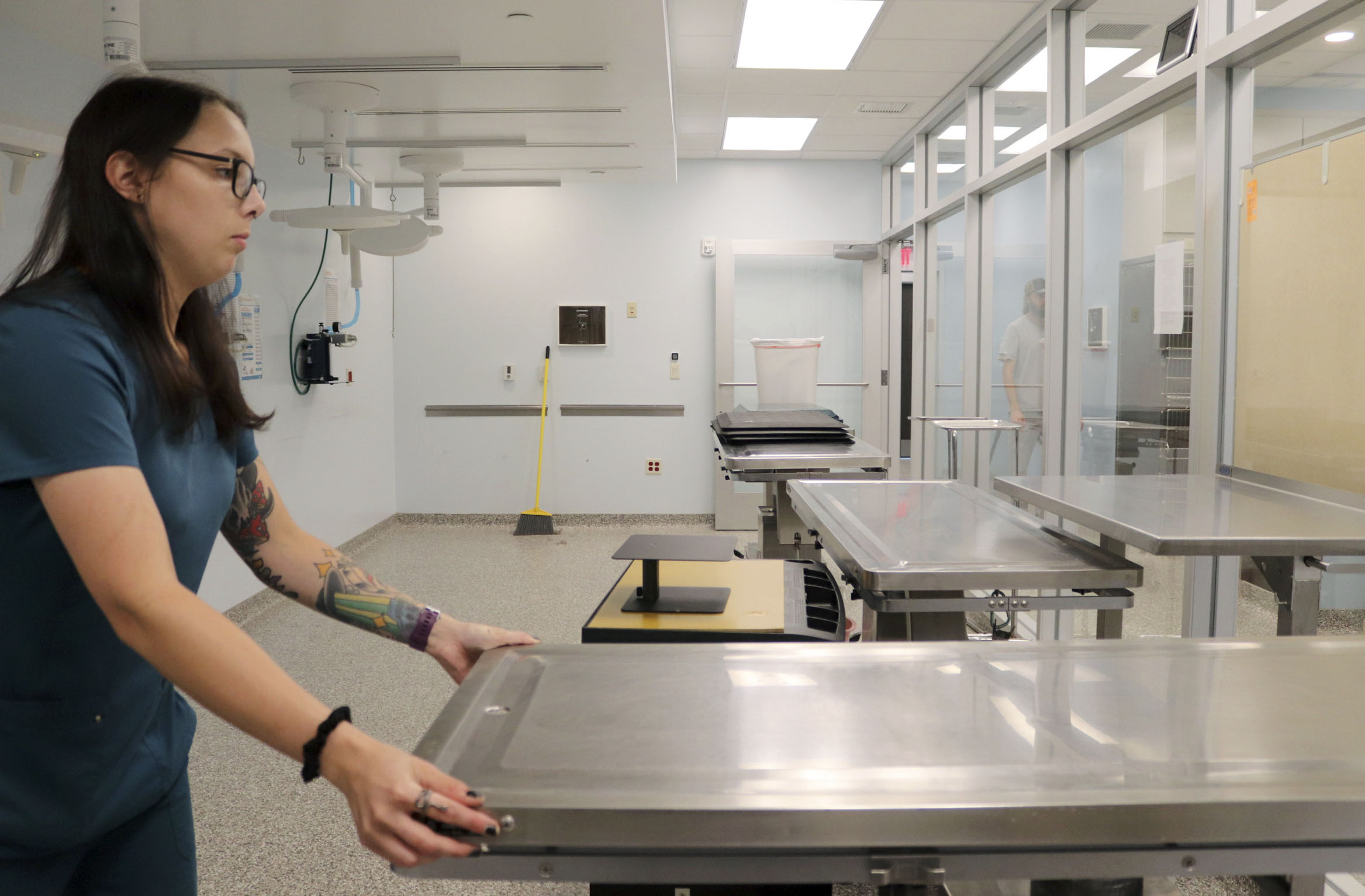 An employee cleans the surgical room on Tuesday, Aug. 23, 2022, at Charles and Lynn Zhang Animal Care & Resource Center in Kalamazoo. There are four surgical tables, allowing for multiple surgeries to happen at once.