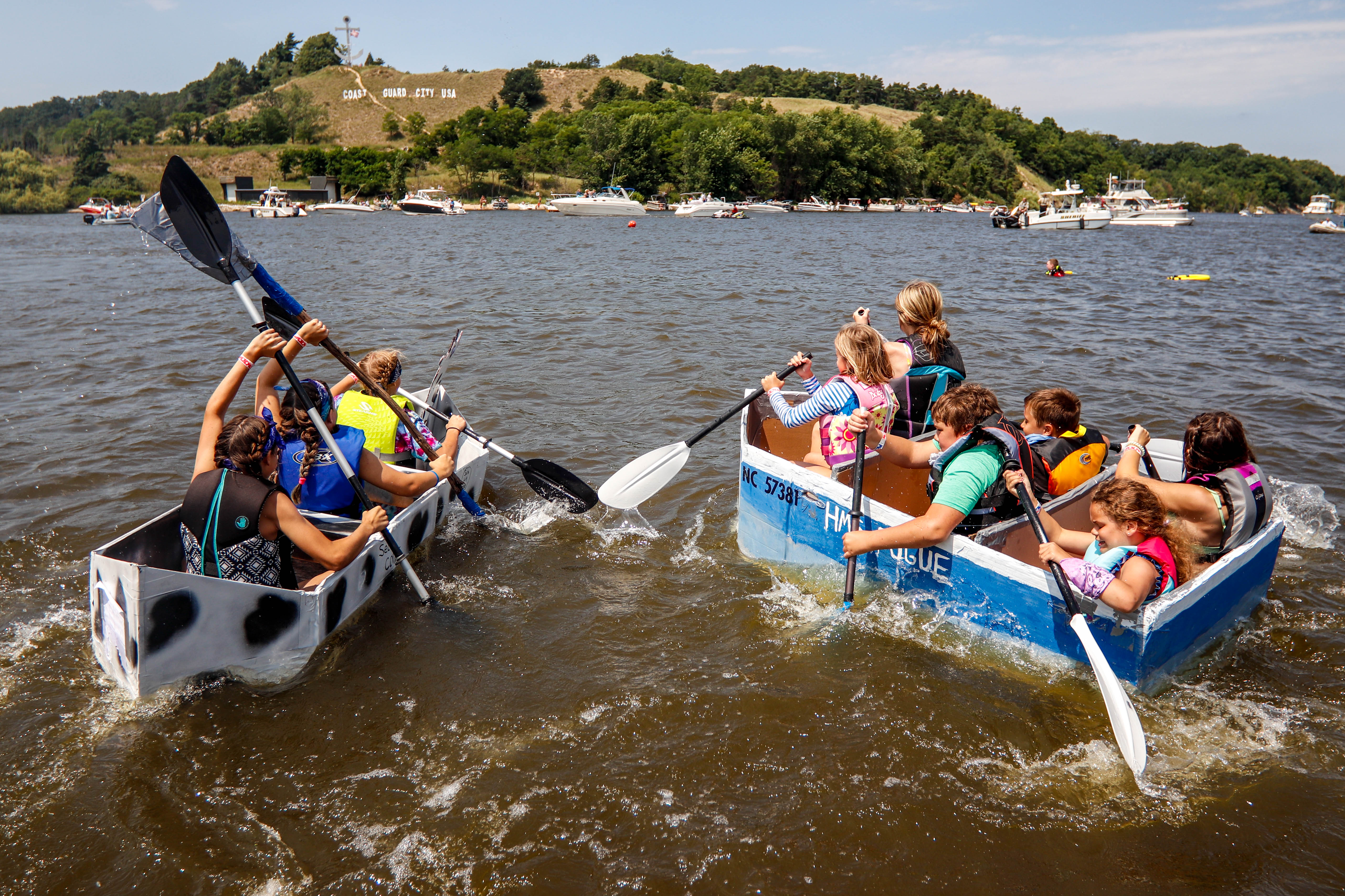 Coast Guard replica boat competing in cardboard boat race