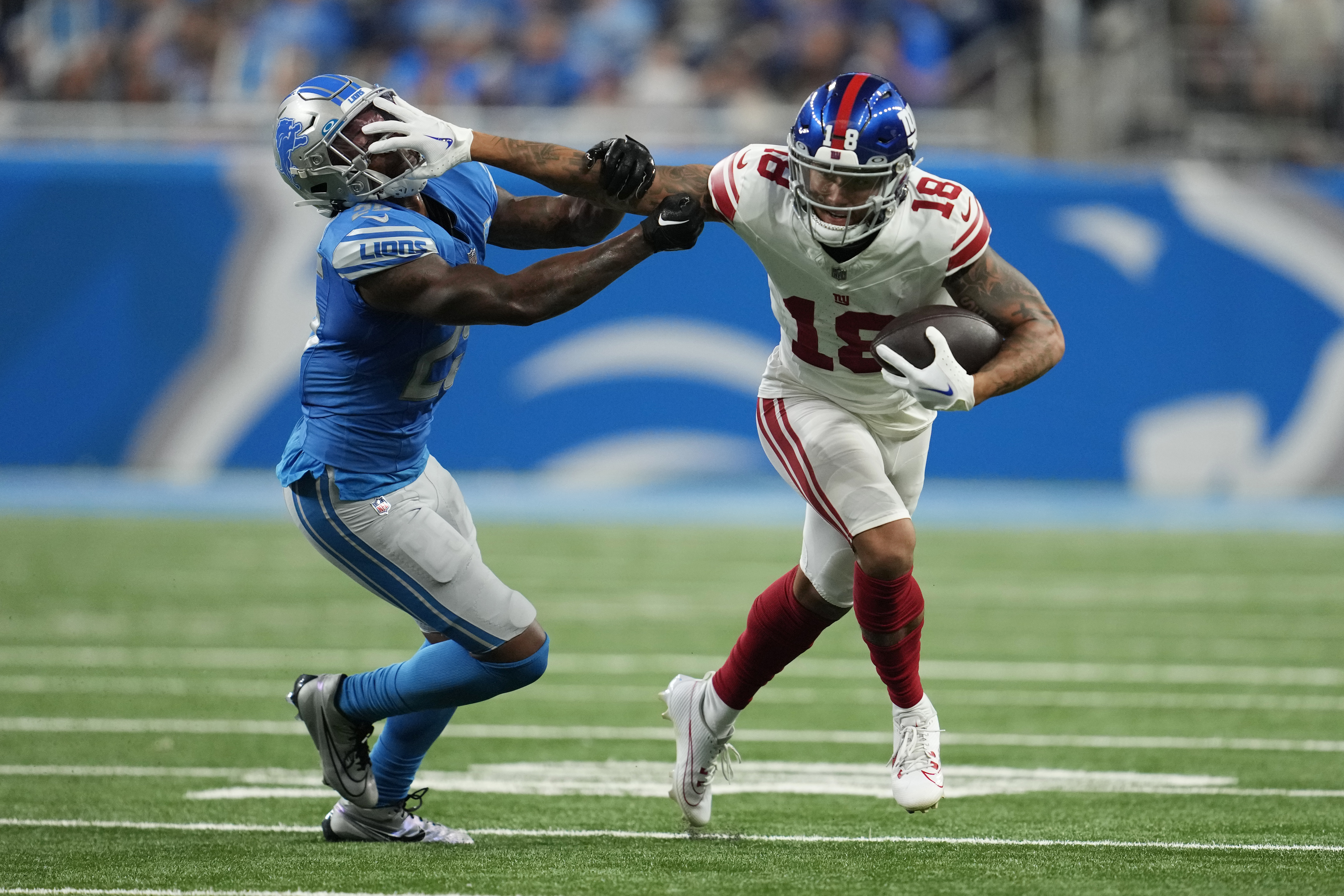 New York Giants wide receiver Isaiah Hodgins (18) runs with the ball  against the Washington Commanders during an NFL football game Sunday, Dec.  4, 2022, in East Rutherford, N.J. (AP Photo/Adam Hunger