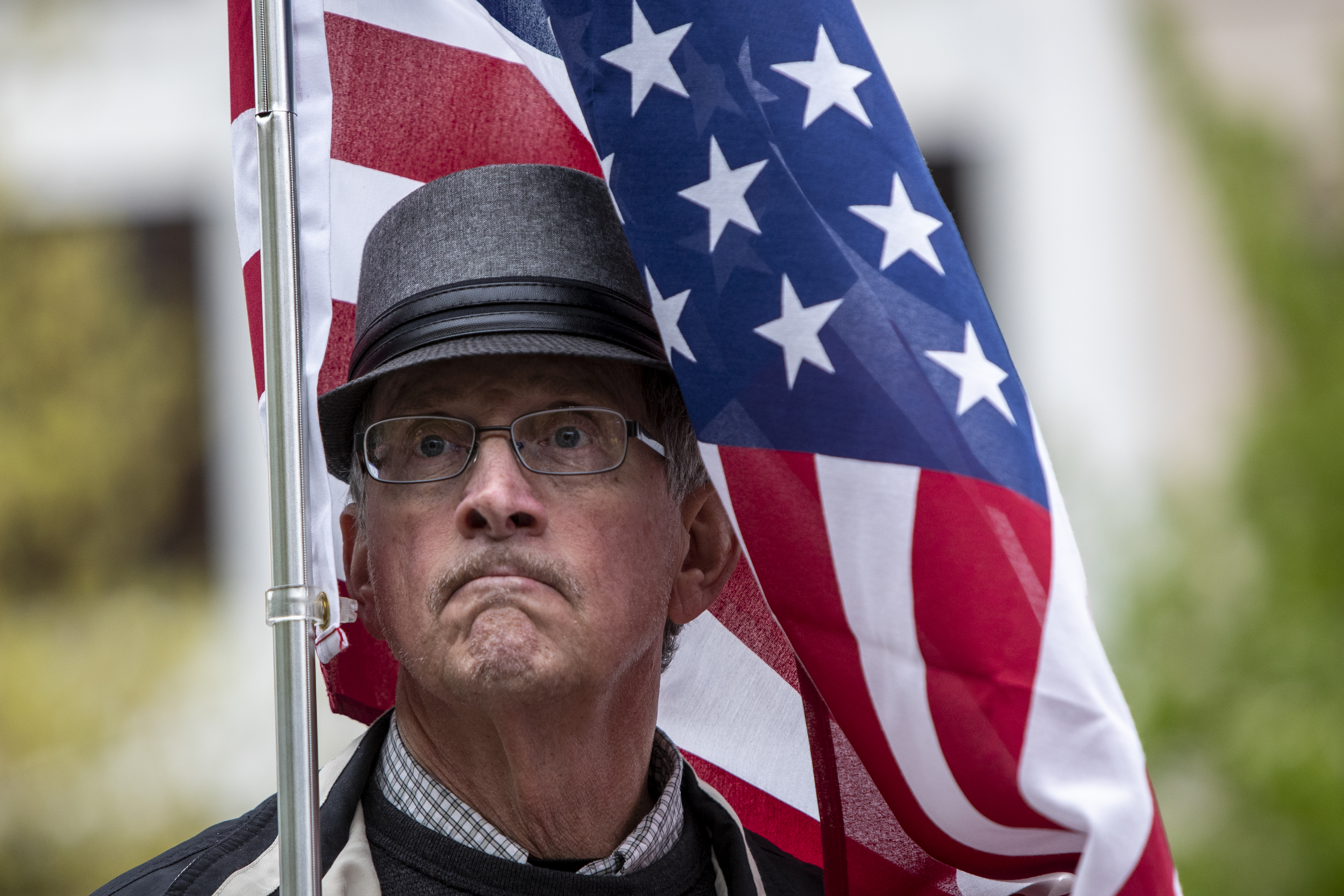 Bruce Beebe, of Newaygo, takes part in the "American Patriot Rally-Sheriffs speak out" event at Rosa Parks Circle in downtown Grand Rapids on Monday, May 18, 2020. The crowd is protesting against Gov. Gretchen Whitmer's stay-at-home order. "Some of the areas should have been opened up long before," he said. (Cory Morse | MLive.com)