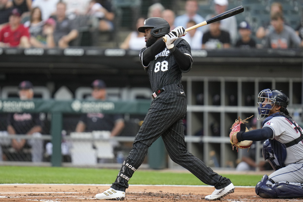 Chicago White Sox's Gavin Sheets (32) celebrates with Elvis Andrus (1)  after hitting a home run