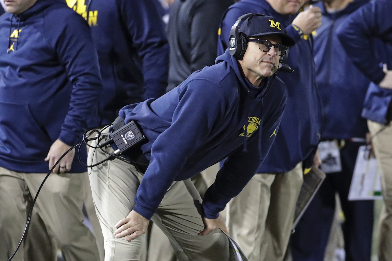 Jim Harbaugh's new thing: Wearing jerseys of local legends around