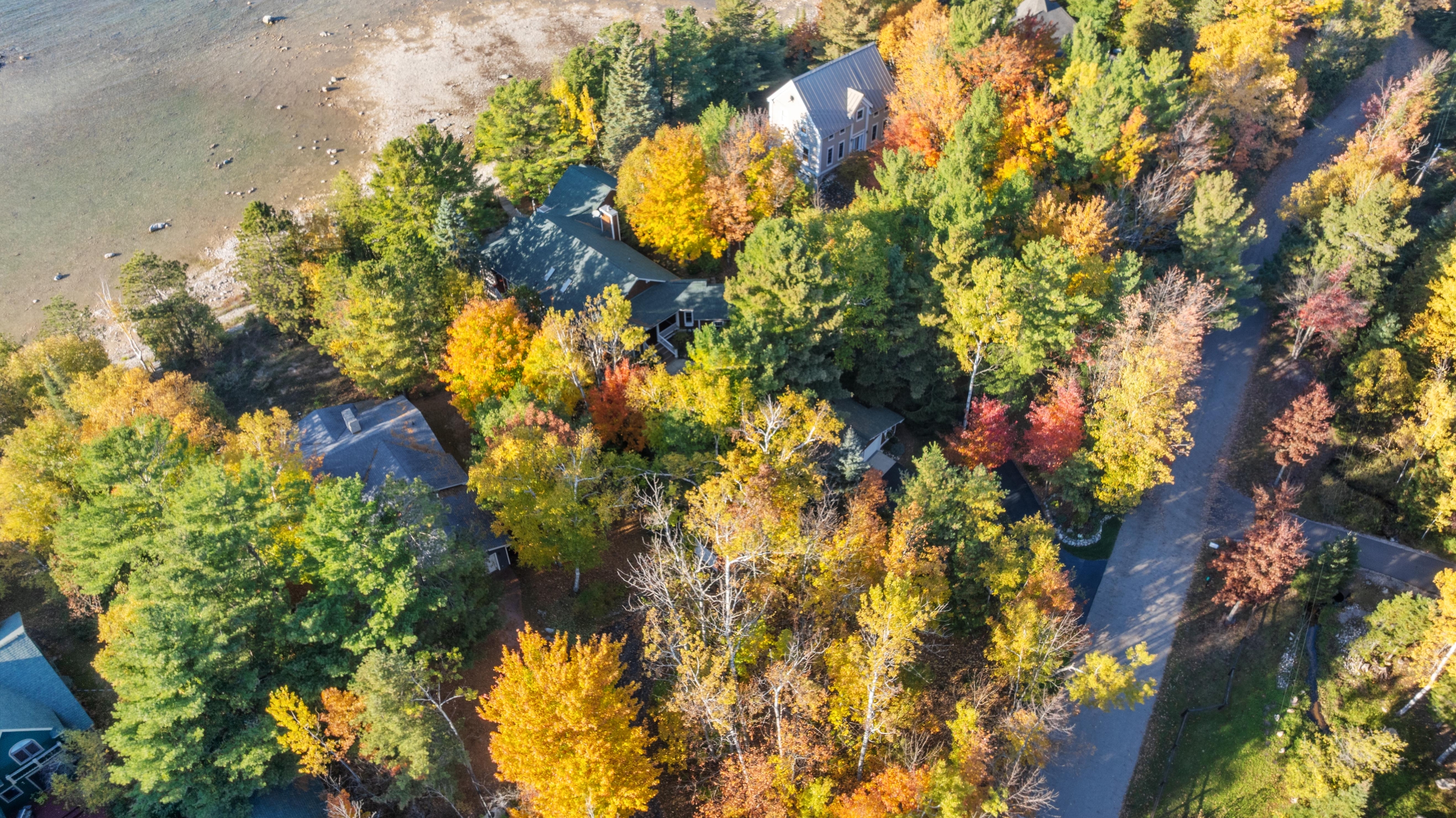 Aerial photographs of 4093 Lake Shore Drive in Charlevoix, this gem is listed at $2,099,900 through Berkshire Hathaway HomeServices Michigan Real Estate – Traverse City and The Crane Group with associate broker Johnny Crane and his brother, co-listing agent Matt Crane.