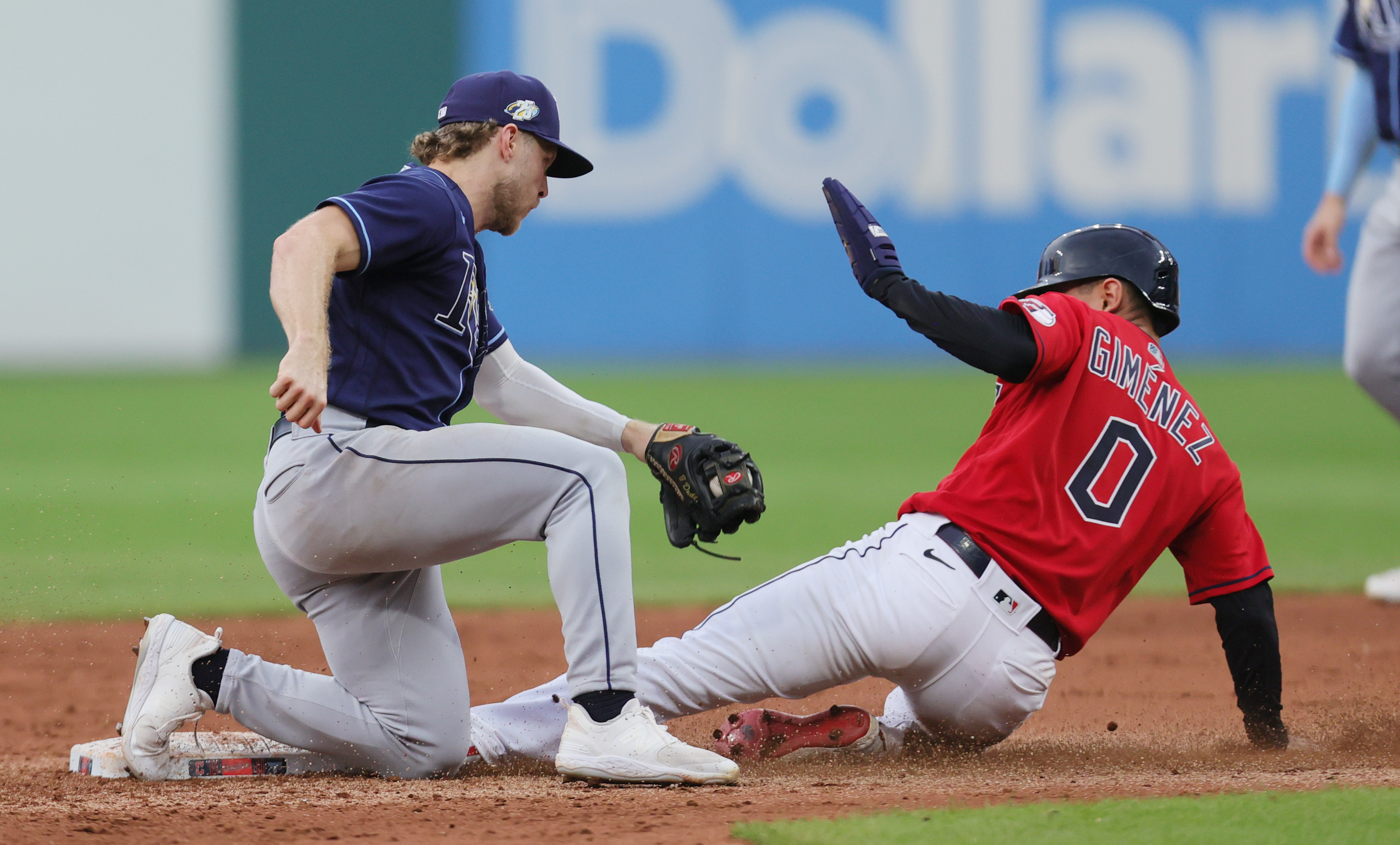 Cleveland Guardians second baseman Andres Gimenez slides safely to second base on a steal as Tampa Bay Rays short stop Taylor Walls applies the late tag in the fifth inning, September 2, 2023, at Progressive Field.