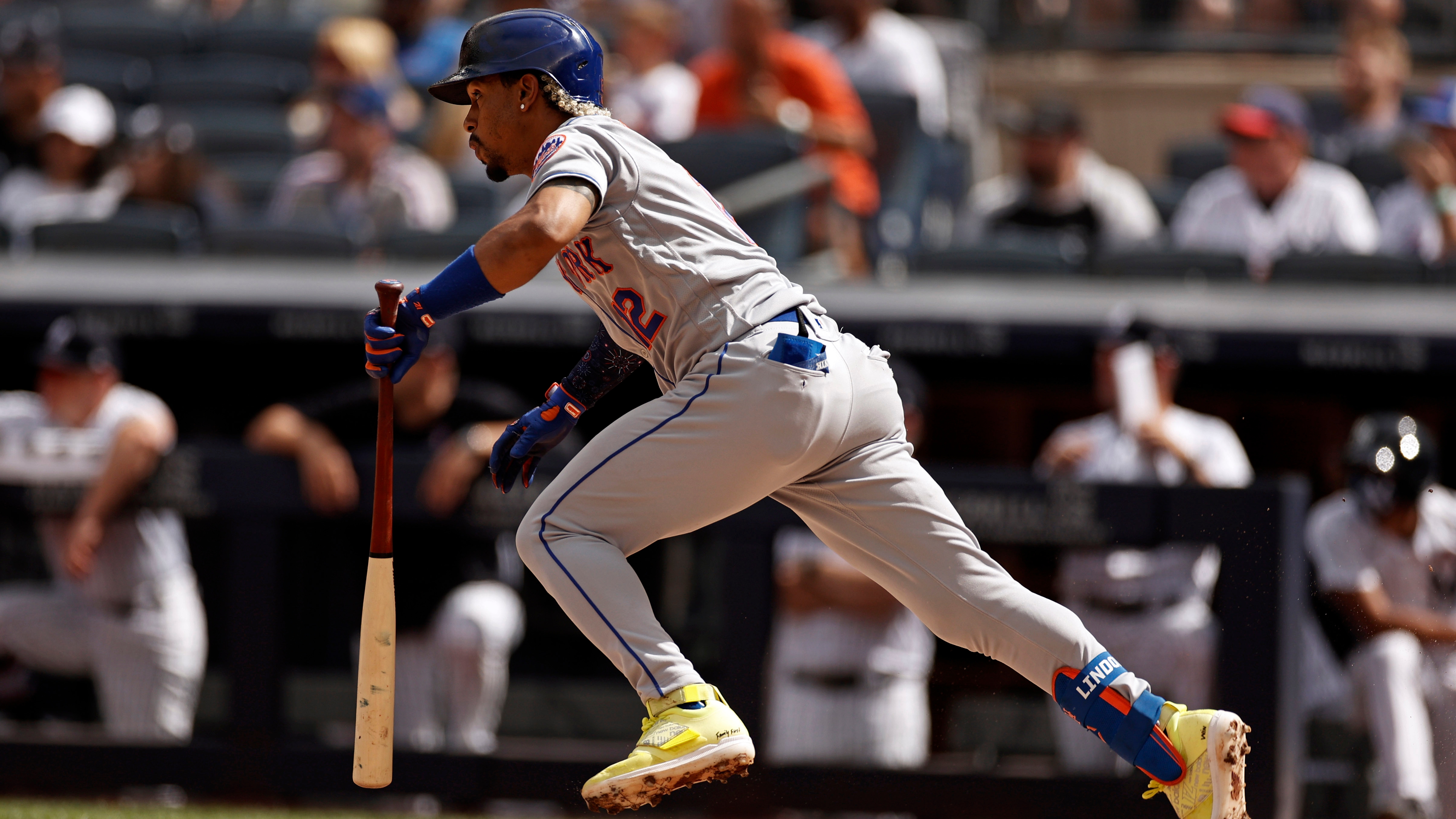 New York Mets Shortstop Francisco Lindor turns a double play on a