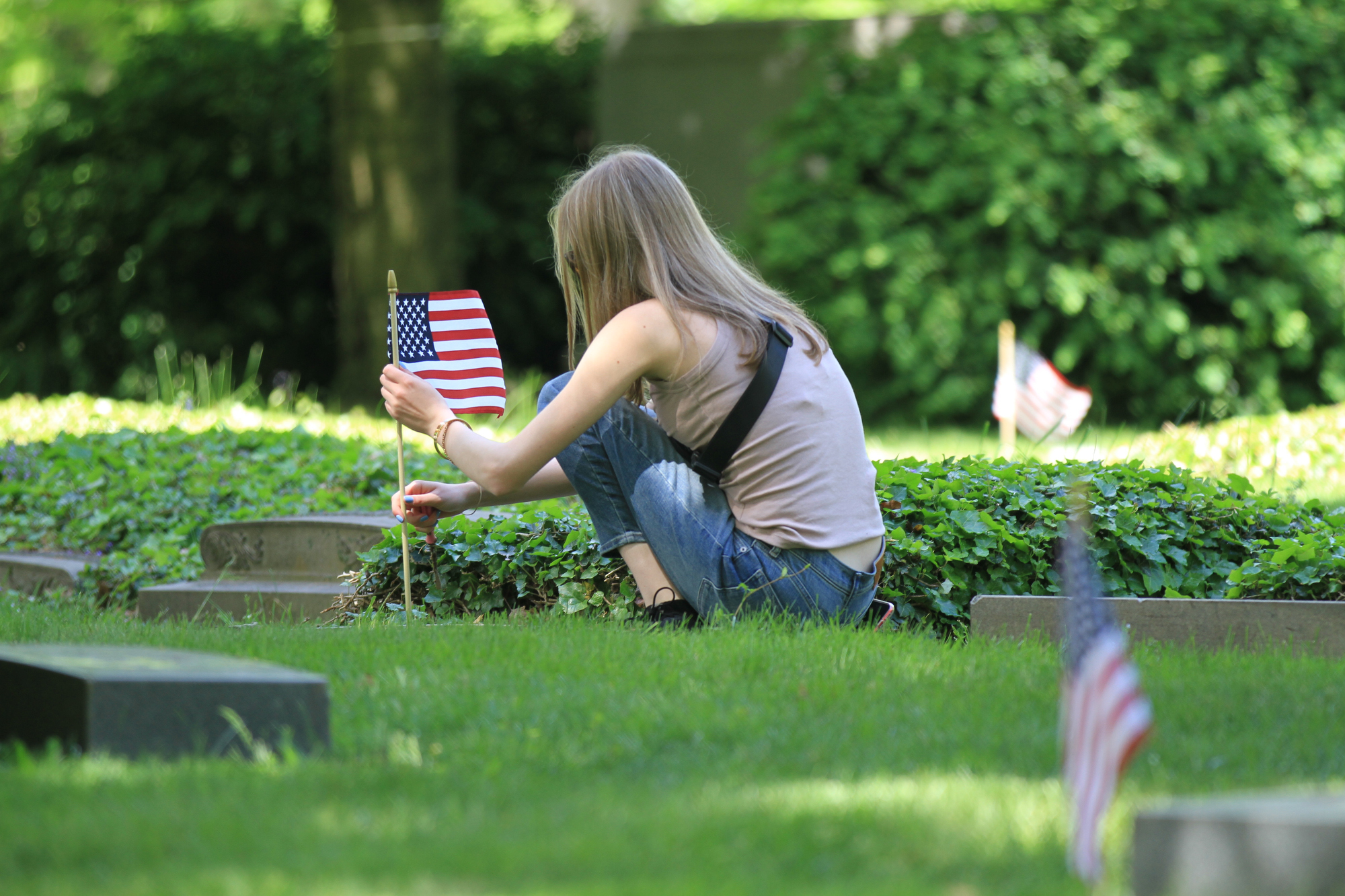 Flags placed on gravesites at Lake View Cemetery for Memorial Day ...