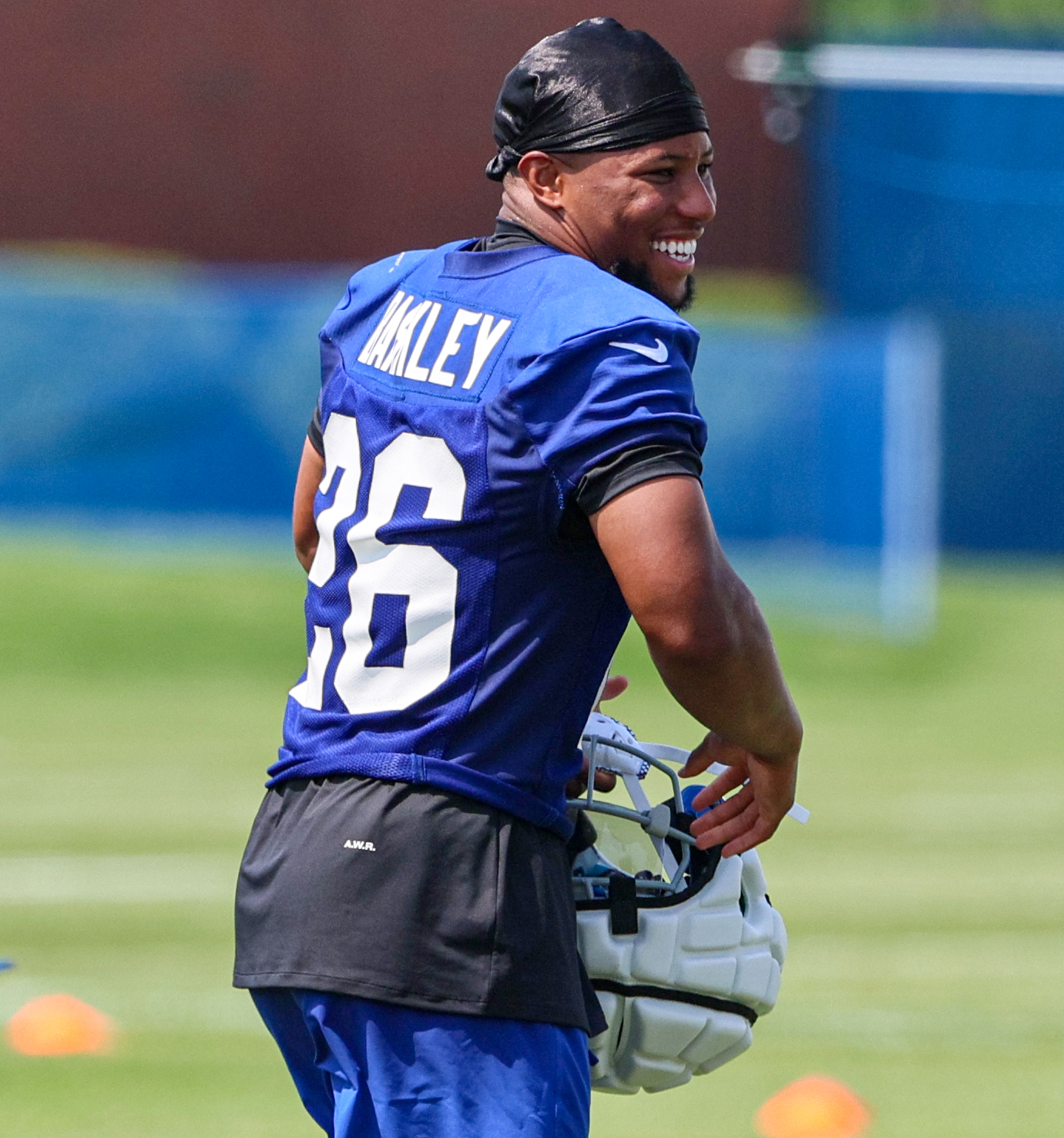 East Rutherford, New Jersey, USA. 30th July, 2019. New York Giants running  back Saquon Barkley (26) smiles after breaking for a long run during  training camp at the Quest Diagnostics Training Center