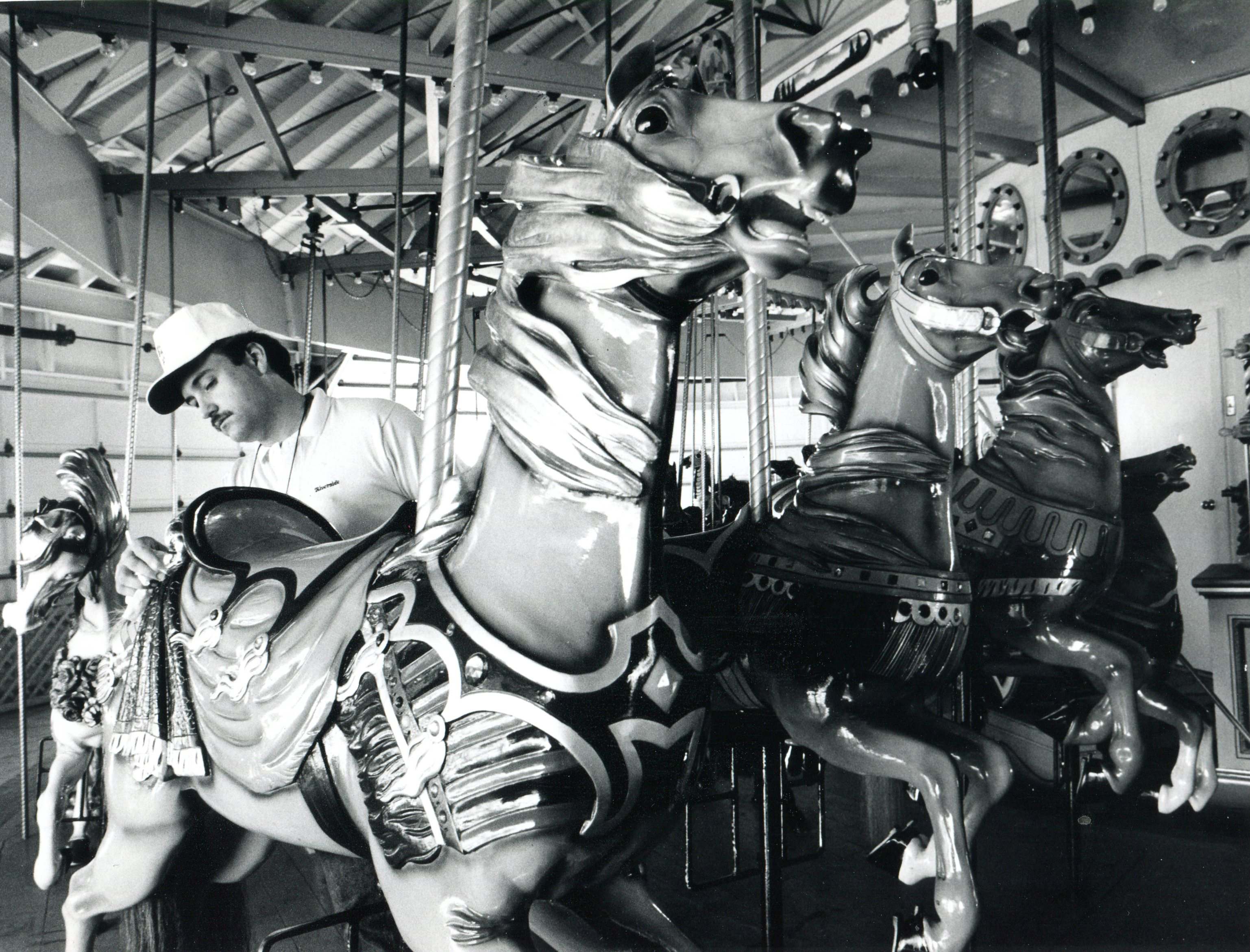 May 13, 1988 - Agawam - William Jatkevicius, manager of maintenance at Riverside Park, cleans one of the horses on the park's 1909 carousel. (Republican file photo) Staff-Shot