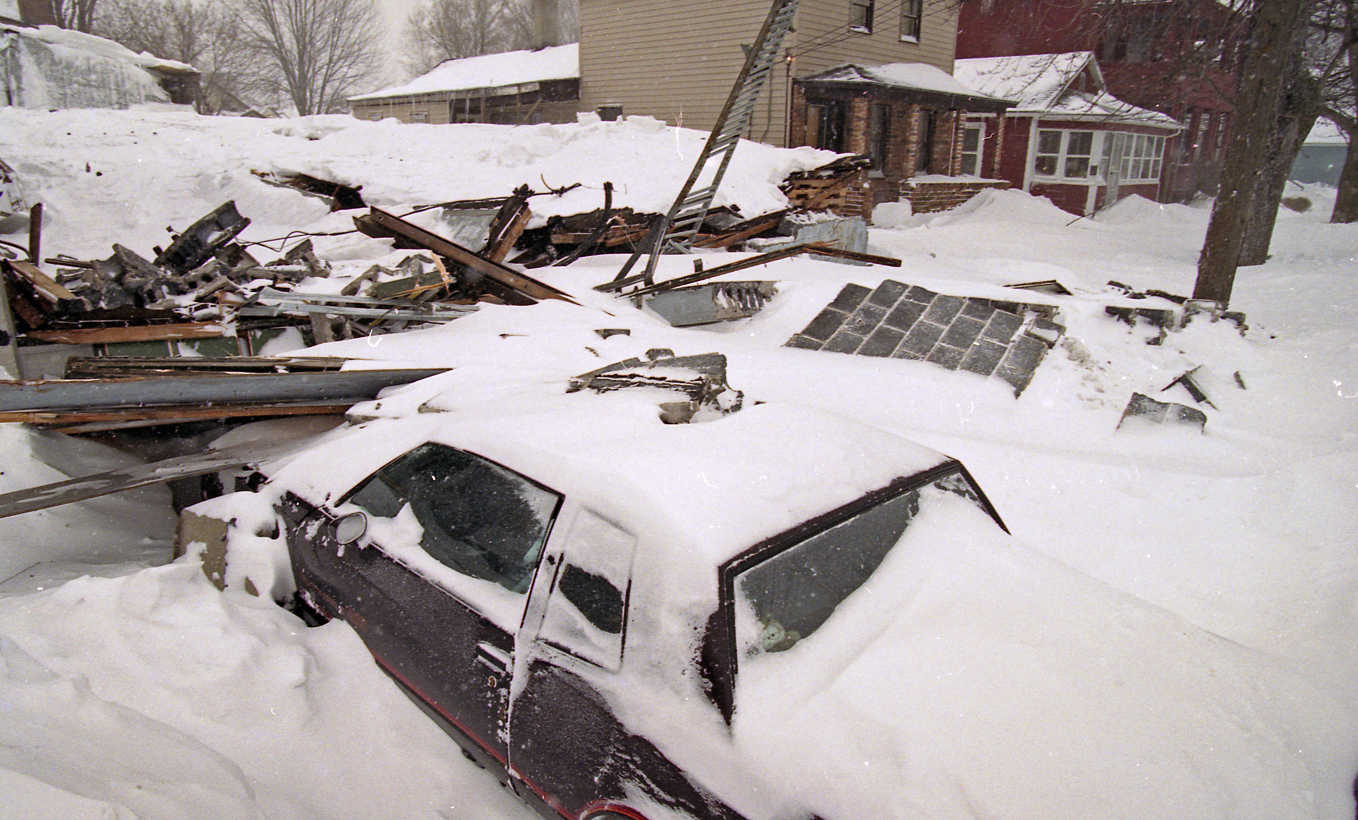 A roof collapsed from the weight of the snow at 308 Marcellus Street, Syracuse, following the Blizzard of '93.