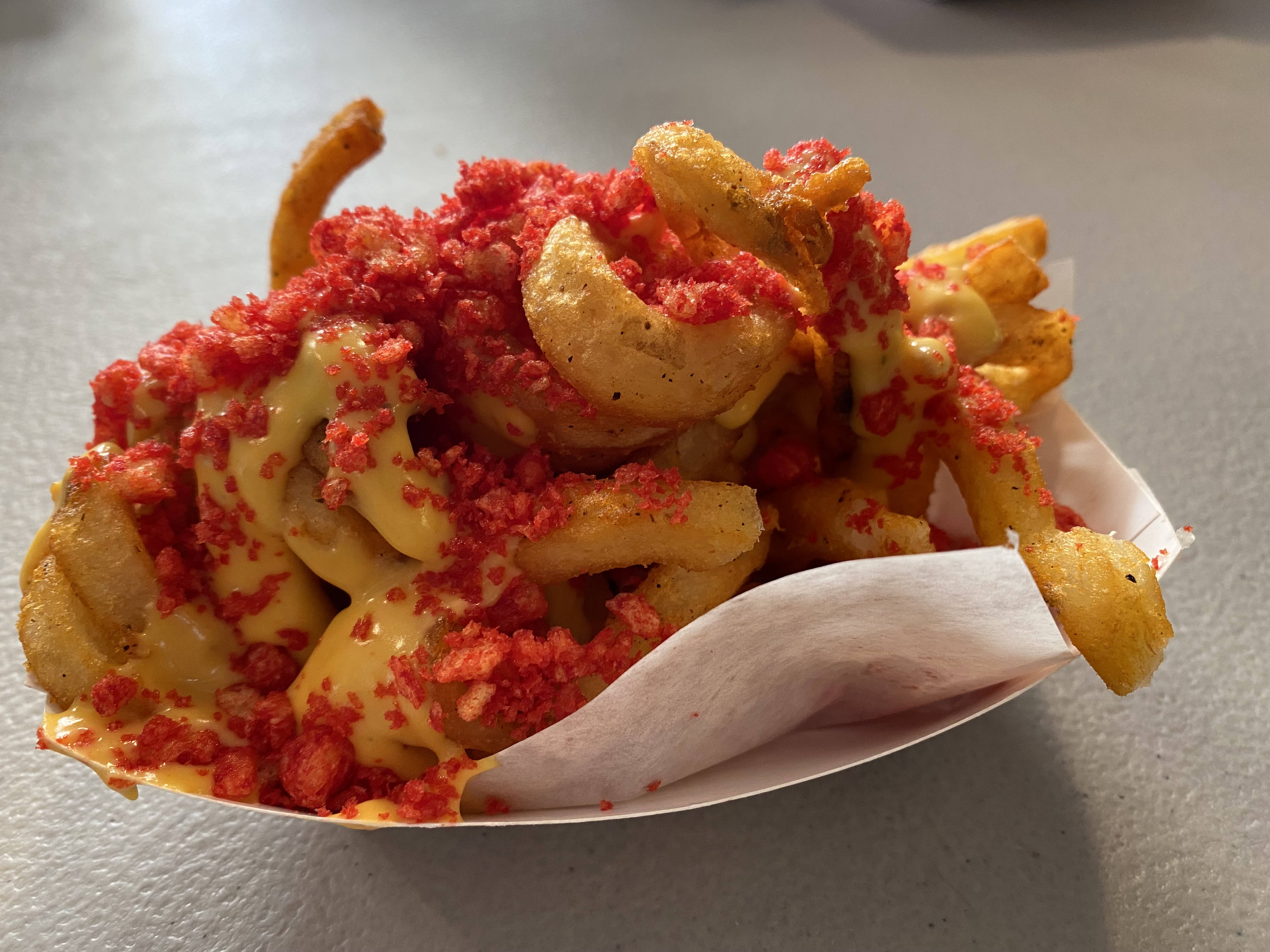 The Flamin' Hot Curly Fries at the Country Corner in The Eatery building a new item at the New York State Fair this year. They are sprinkled with crushed Cheetoh's.
Photo by Mike Waters | mwaters@syracuse.com