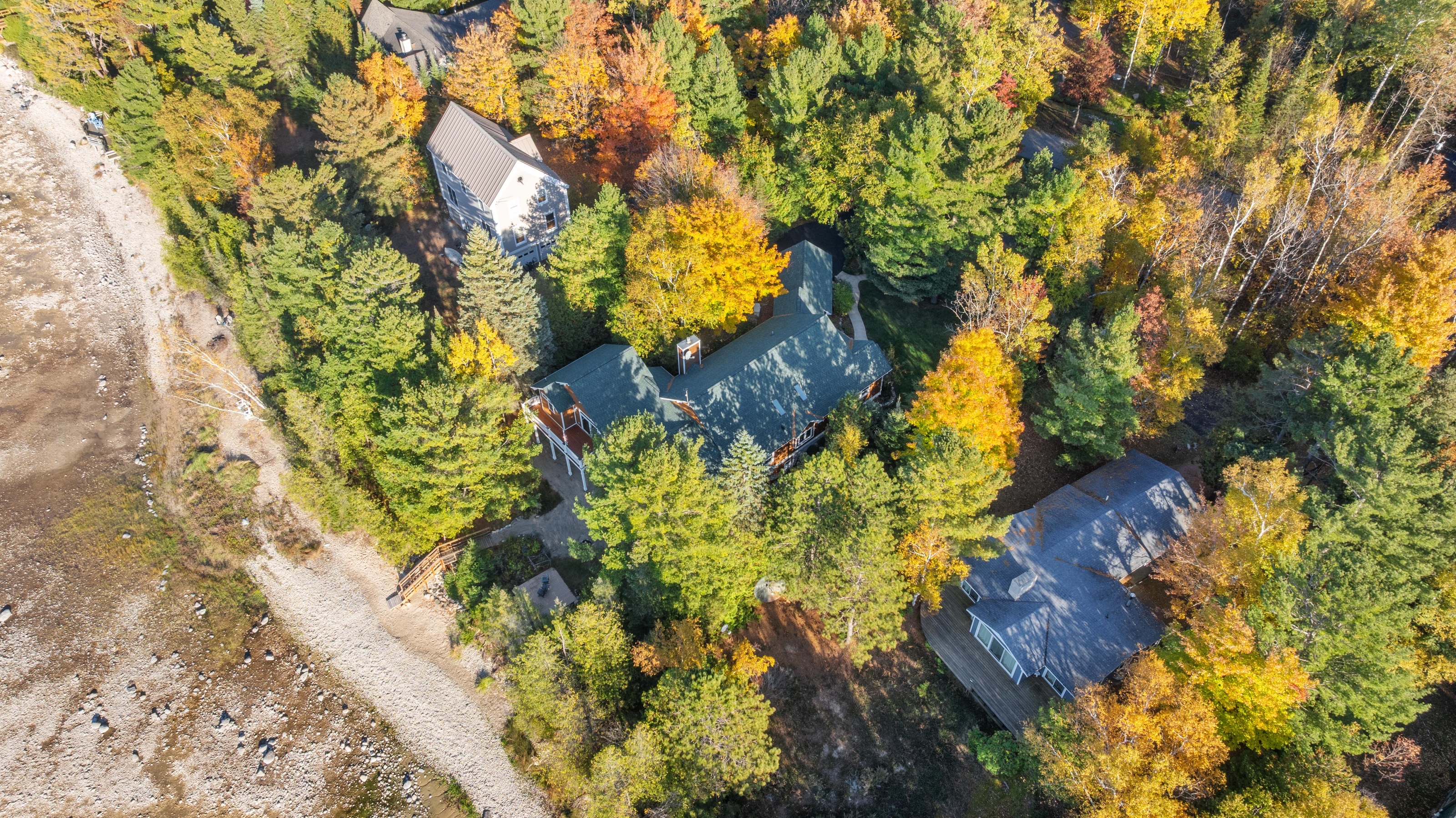 Aerial photographs of 4093 Lake Shore Drive in Charlevoix, this gem is listed at $2,099,900 through Berkshire Hathaway HomeServices Michigan Real Estate – Traverse City and The Crane Group with associate broker Johnny Crane and his brother, co-listing agent Matt Crane.