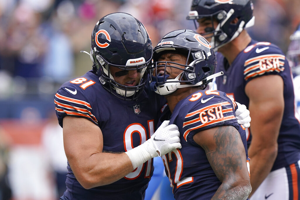 Chicago Bears running back David Montgomery (32) celebrates his touchdown  during the first half of an NFL football game against the Detroit Lions,  Sunday, Oct. 3, 2021, in Chicago. (AP Photo/Kamil Krzaczynski