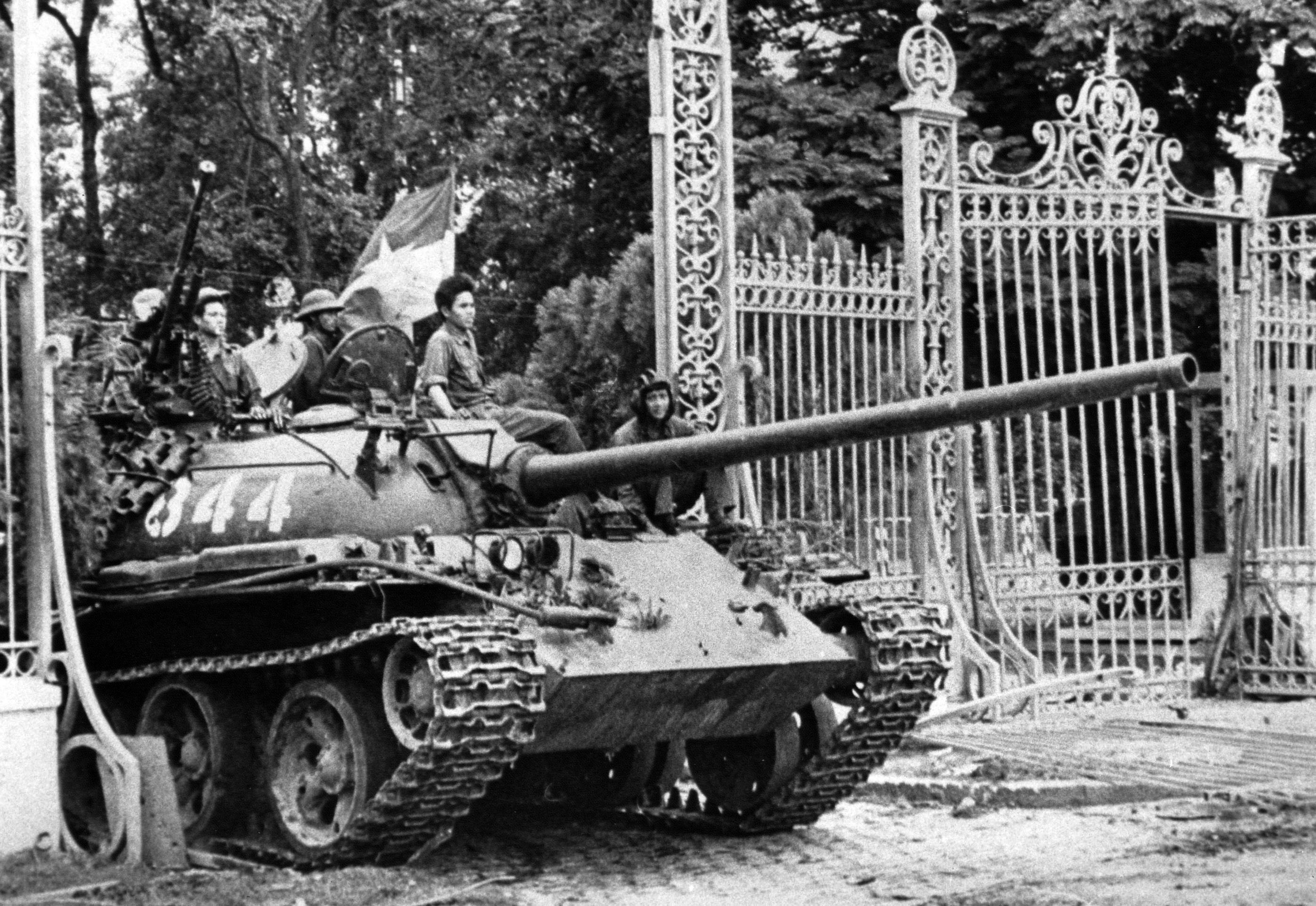 A North Vietnamese tank rolls through the gate of the Presidential Palace in Saigon, April 30, 1975, signifying the fall of South Vietnam. (AP Photo)