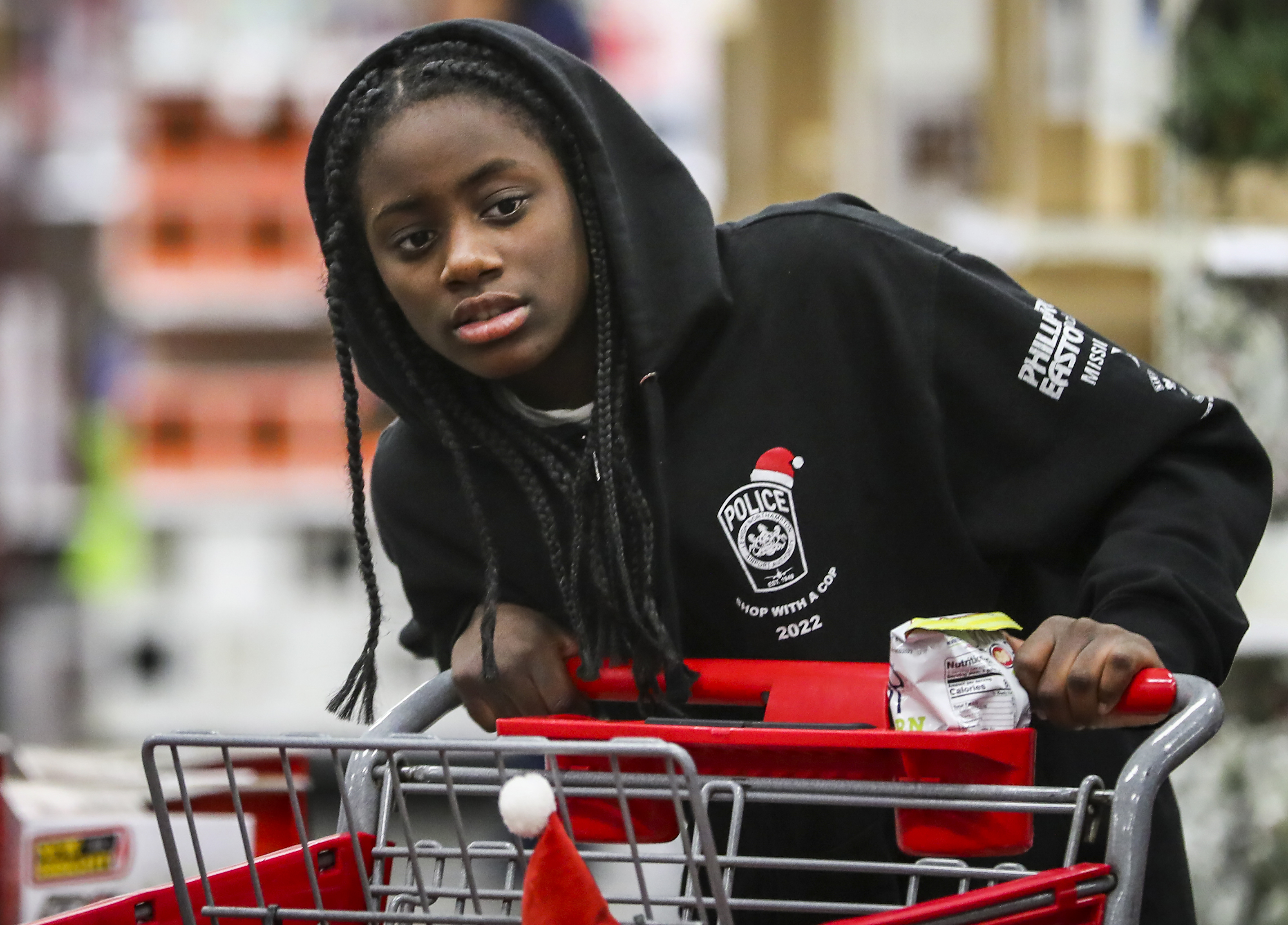 Ty’Nayja Taylor, 12, wanders the isles looking for the right gifts to buy. She was among 22 children and their families from the Catasauqua Area School District who were accompanied by Lehigh-Northampton Airport Authority Police Department during the shopping spree Saturday, Dec. 3, 2022, at Target in Hanover Township, Lehigh County. 