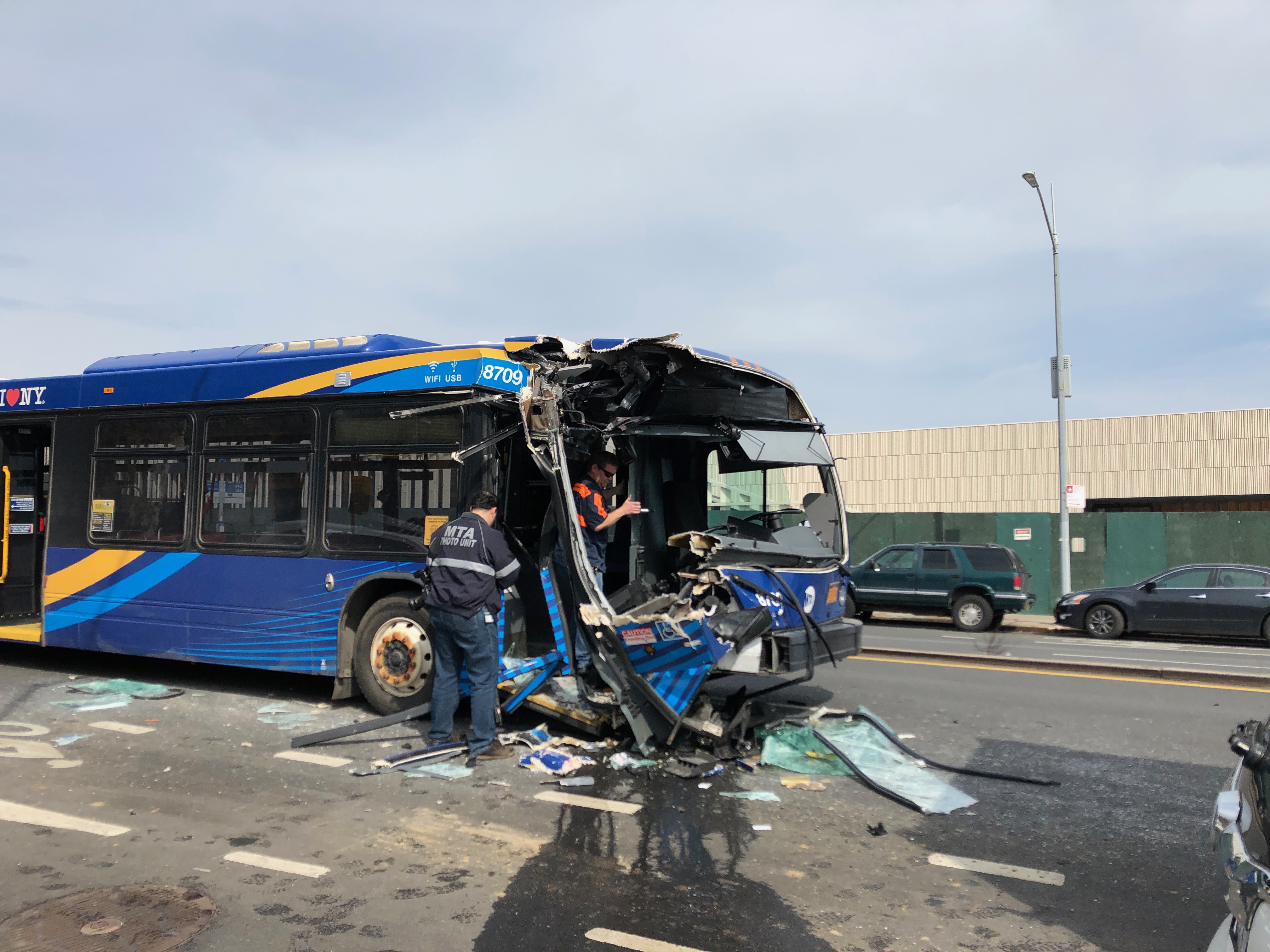 Several cars struck by MTA bus, stacked on top of each other in