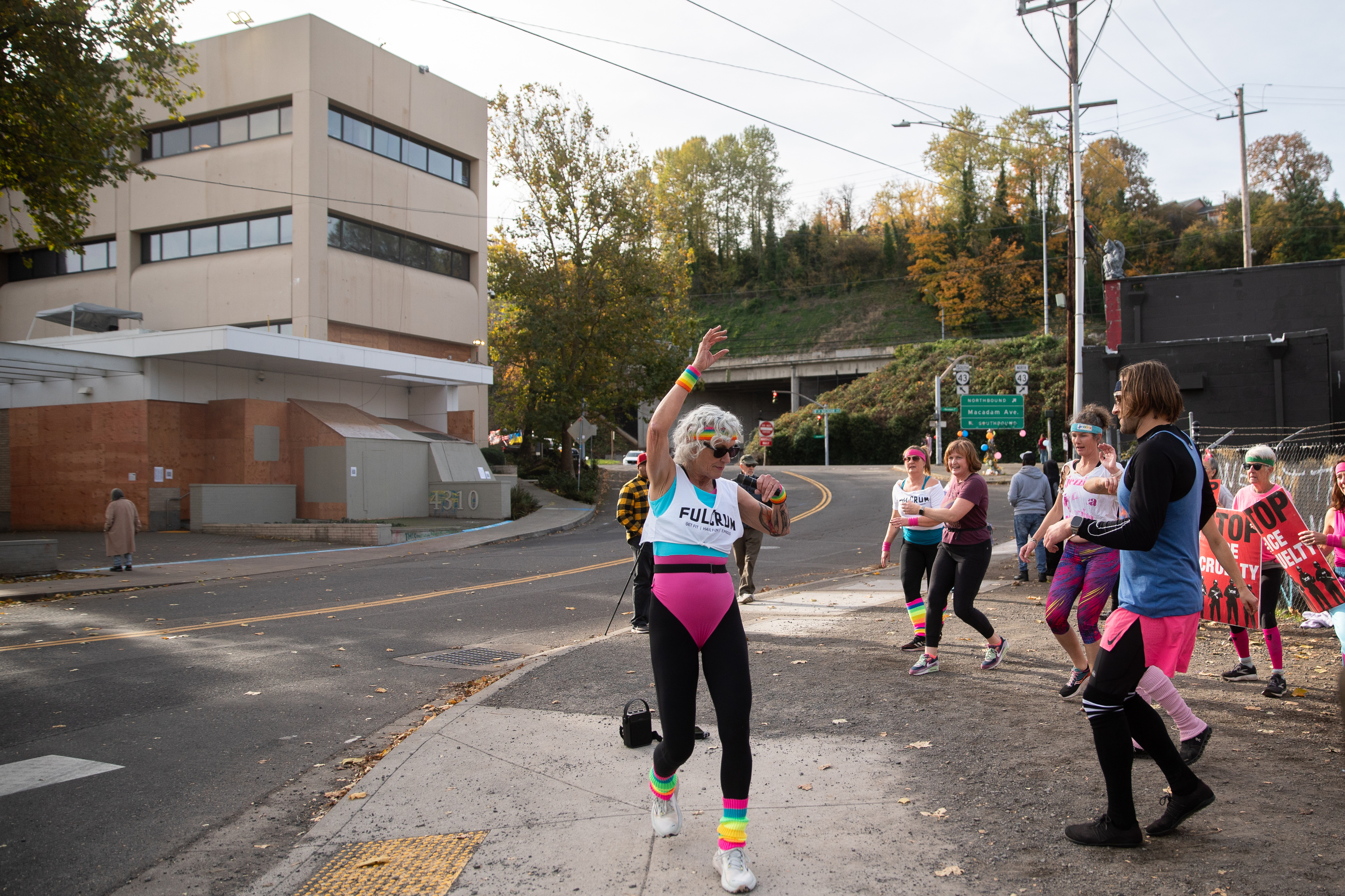 Participants in Fulcrum Fitness’s “Sweatin’ Out the Fascists” held an ’80s-aerobics peaceful protest outside the U.S. Immigration and Customs Enforcement (ICE) facility in South Portland on Sunday, Nov. 9, 2025, collecting donations for the Oregon Food Bank.