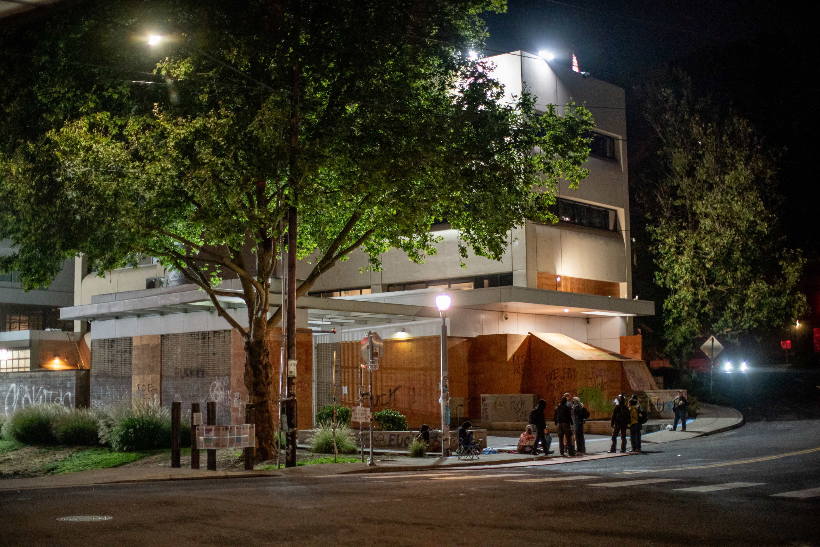 Protesters gather outside the boarded-up U.S. Immigration and Customs Enforcement building in South Portland on Monday, Sept. 8, 2025, days after President Donald Trump suggested federal intervention.