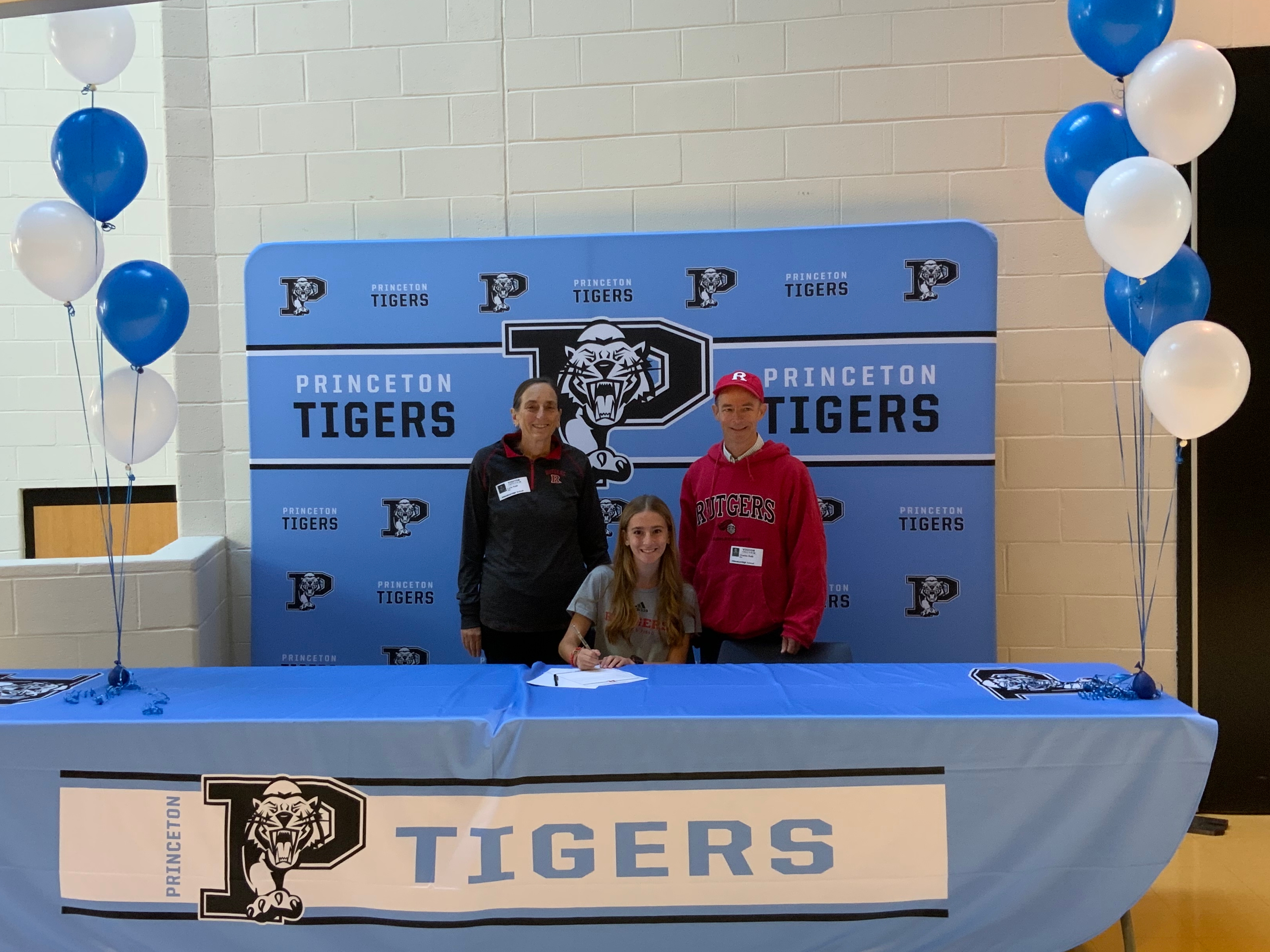 Princeton High School Student Athlete Robin Roth will be attending Rutgers University  for Track Field. In this photo Robin is accompanied by her parents Charlie and Lorie Roth.