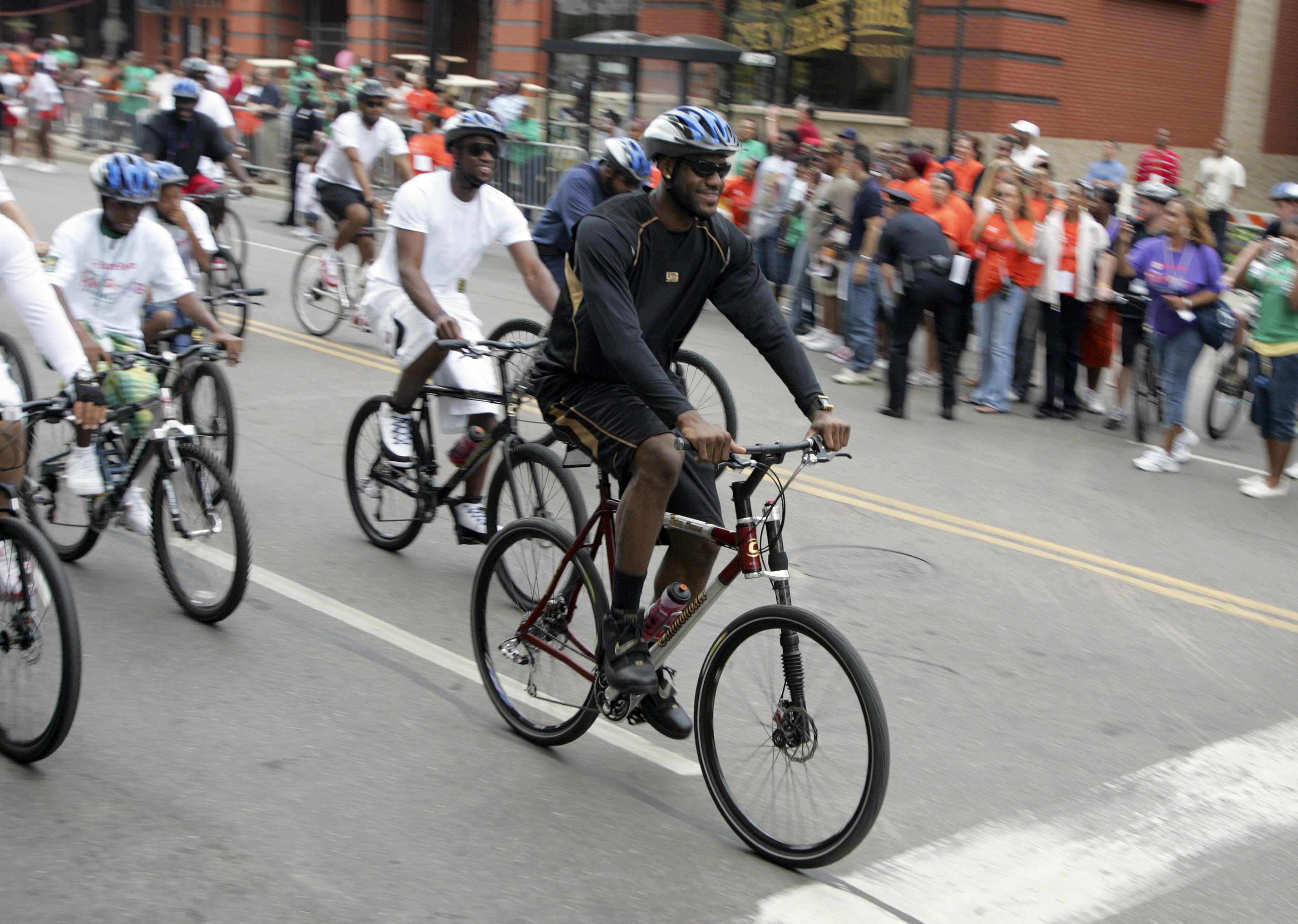 LeBron James takes off on an eight mile ride during the State Farm King for Kids Bikeathon in Akron Saturday, June 21, 2008. The popular family-friendly fundraising event, which is made possible with the support and cooperation of the City of Akron, will recognize and reward Akron-area children who have achieved academic success, improved their physical fitness and made important contributions to the community.    (Joshua Gunter/ The Plain Dealer)