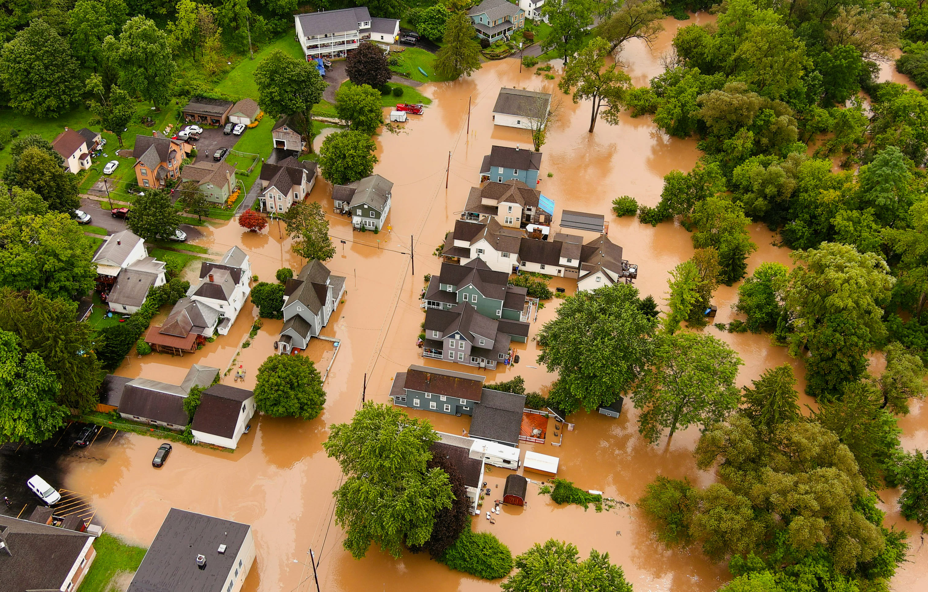 An aerial view of the Village of Camillus where Ninemile Creek flooded streets August 19, 2021, after heavy rainfall.