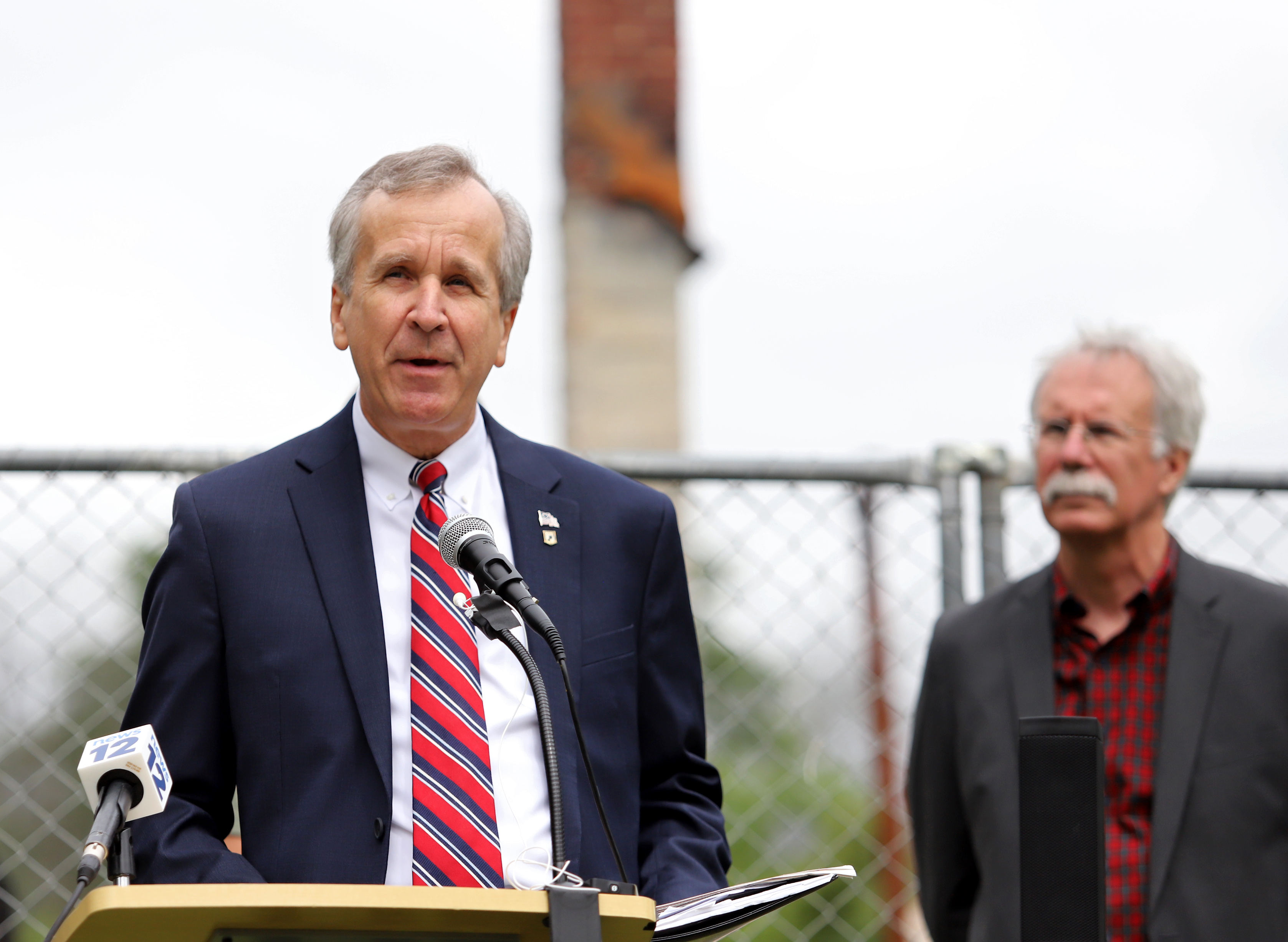 Environmental leaders and elected officials hold a press conference on flooding issues and