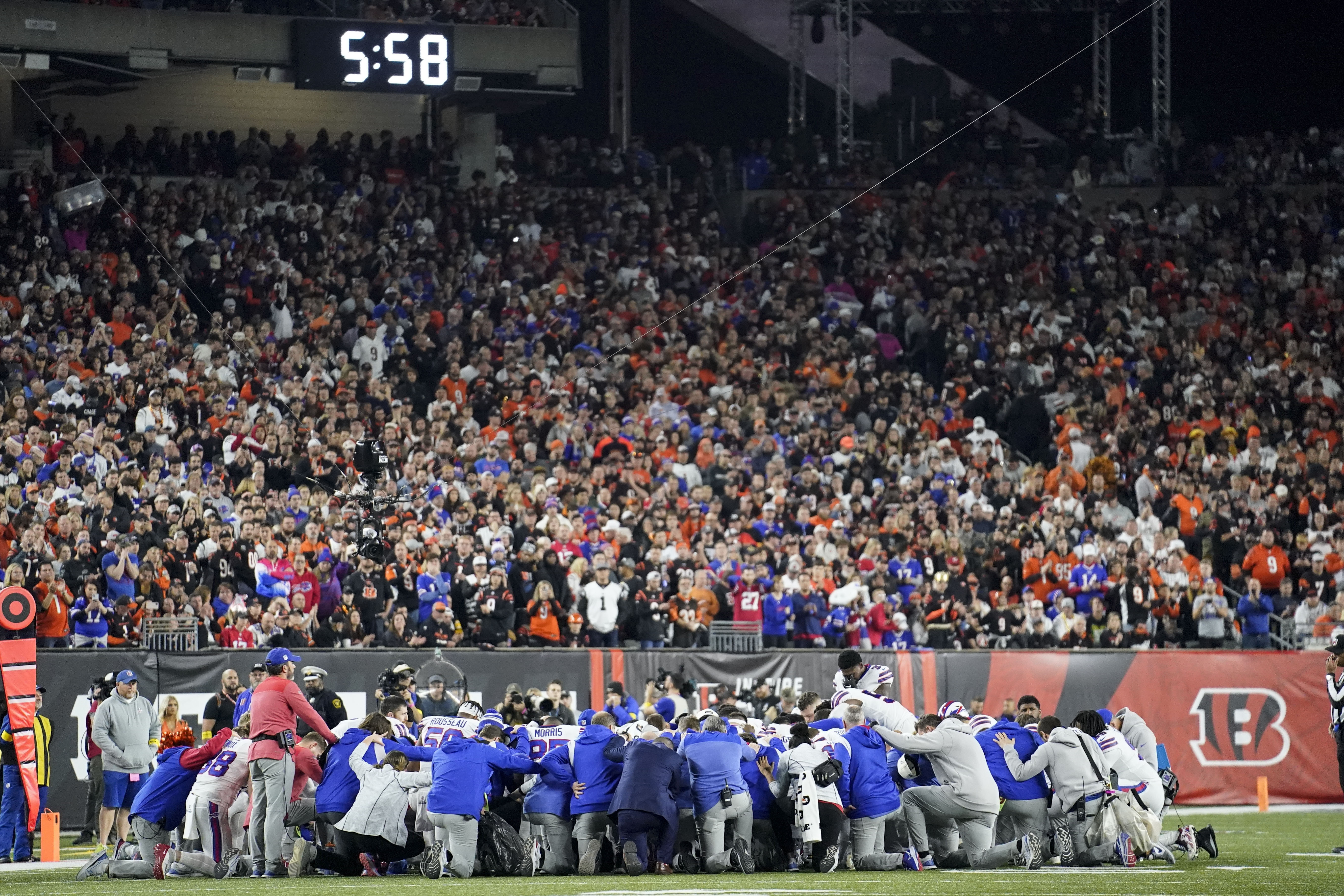 Bengals fans joined in the Lord's Prayer as Bills safety Damar Hamlin was  treated on the field