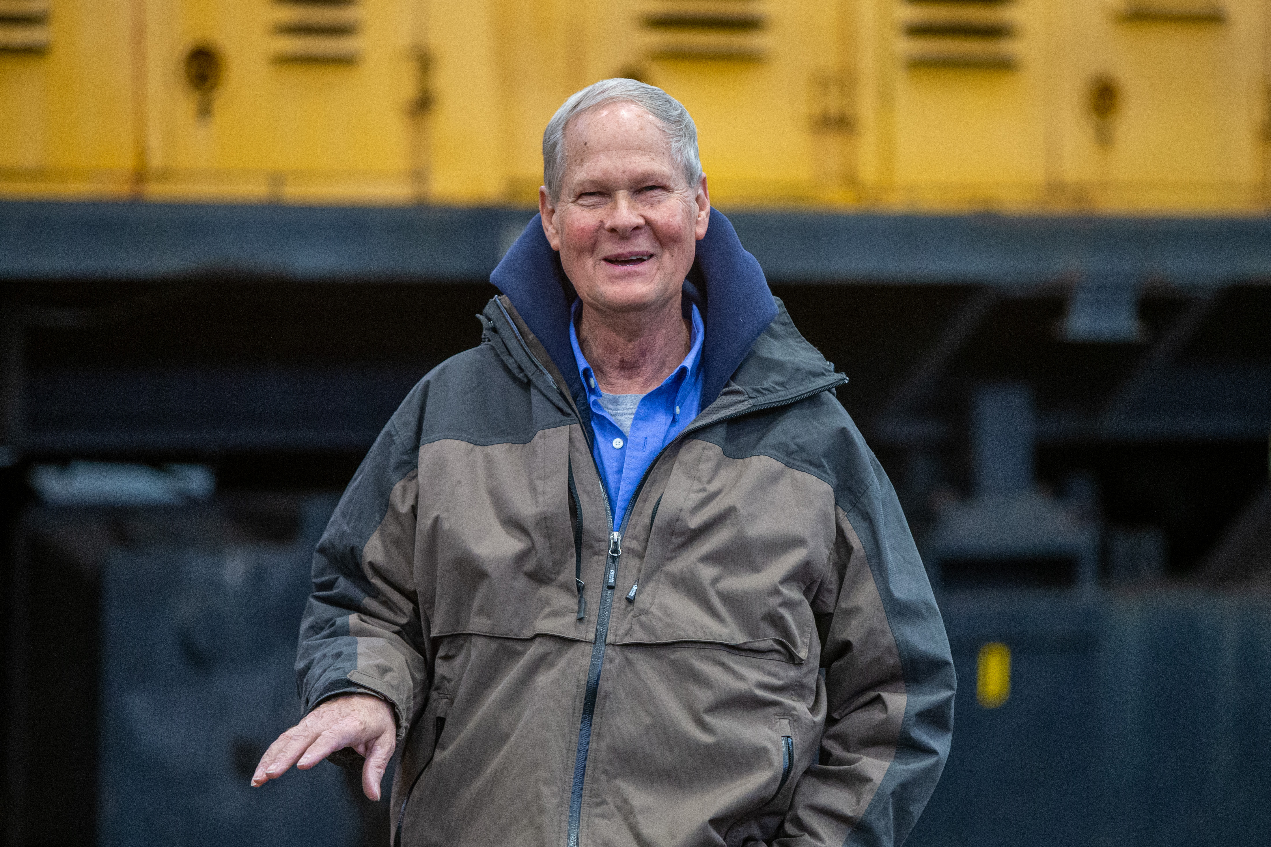 Jeff DuPilka, president of Coopersville and Marne Railway, speaks in front of a 1979 GE diesel train locomotive at the Consumers Energy J.H. Campbell plant in West Olive on Monday, Feb. 13, 2023. Consumers Energy is donating the locomotive to the railway. (Cory Morse | MLive.com)
