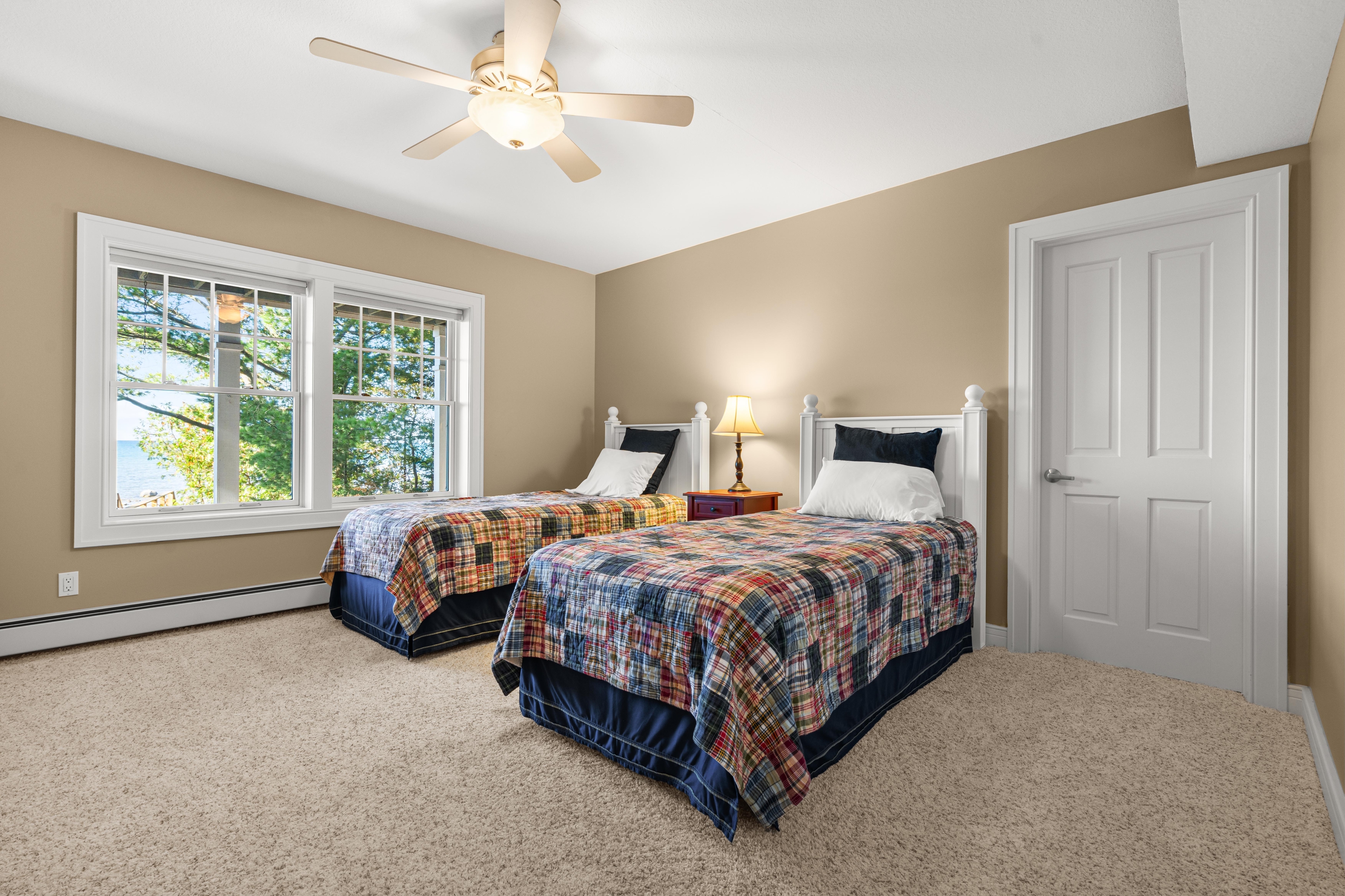 Interior photographs of 4093 Lake Shore Drive in Charlevoix, this gem is listed at $2,099,900 through Berkshire Hathaway HomeServices Michigan Real Estate – Traverse City and The Crane Group with associate broker Johnny Crane and his brother, co-listing agent Matt Crane.