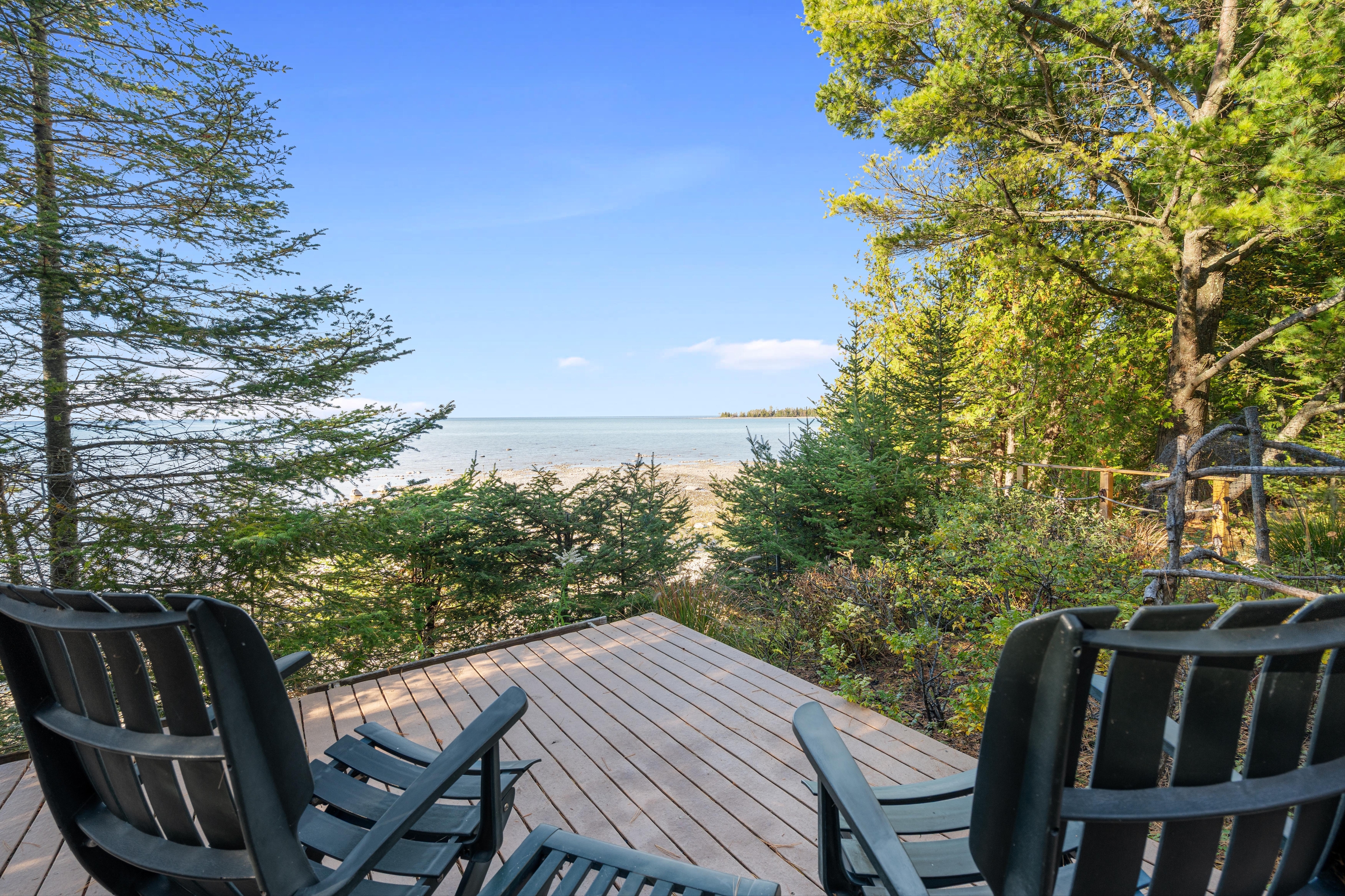 Exterior photographs of 4093 Lake Shore Drive in Charlevoix, this gem is listed at $2,099,900 through Berkshire Hathaway HomeServices Michigan Real Estate – Traverse City and The Crane Group with associate broker Johnny Crane and his brother, co-listing agent Matt Crane.