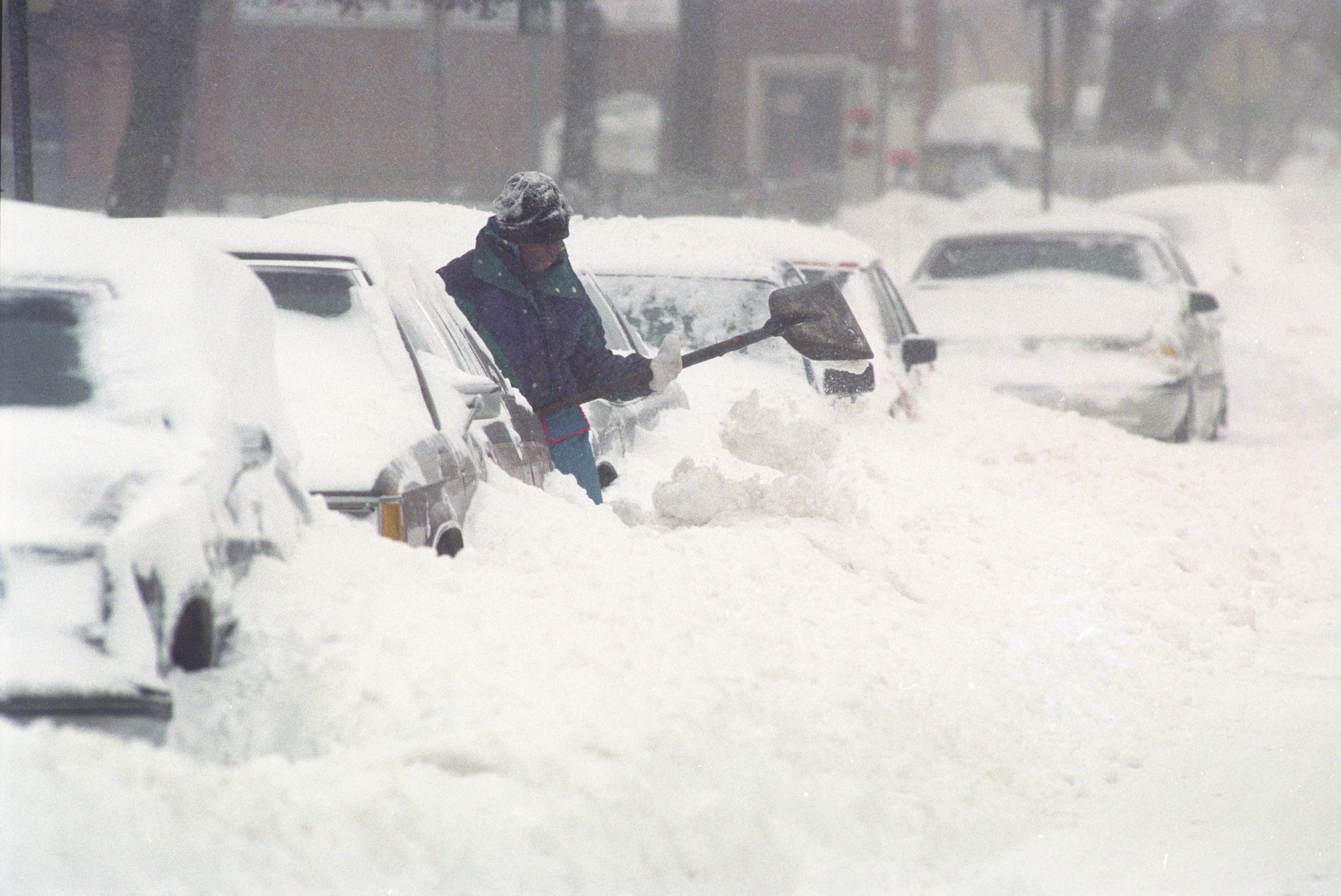 LaTaiva Escho shovels a path from his home along East Raynor Street in Syracuse. The Blizzard of 1993 storm dumped some 40 inches of snow on the area. Nicholas Lisi / The Post-Standard