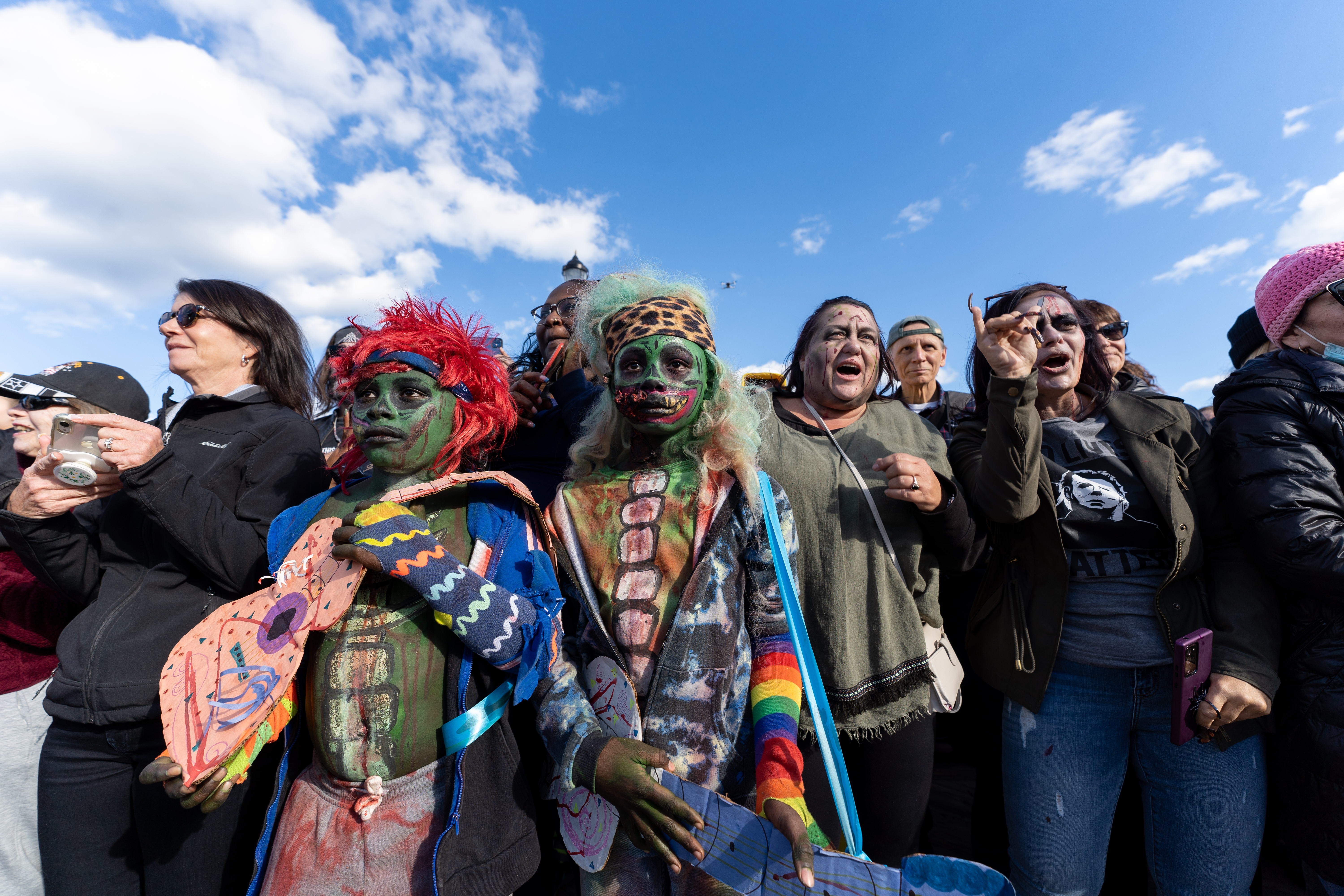 A crowd of zombies gather on the boardwalk to participate in the 14th Asbury Park Zombie Walk in Asbury Park on Saturday, October 8, 2022. The zombie walk held its first themed year with the theme being 80's and 90's punk and metal.