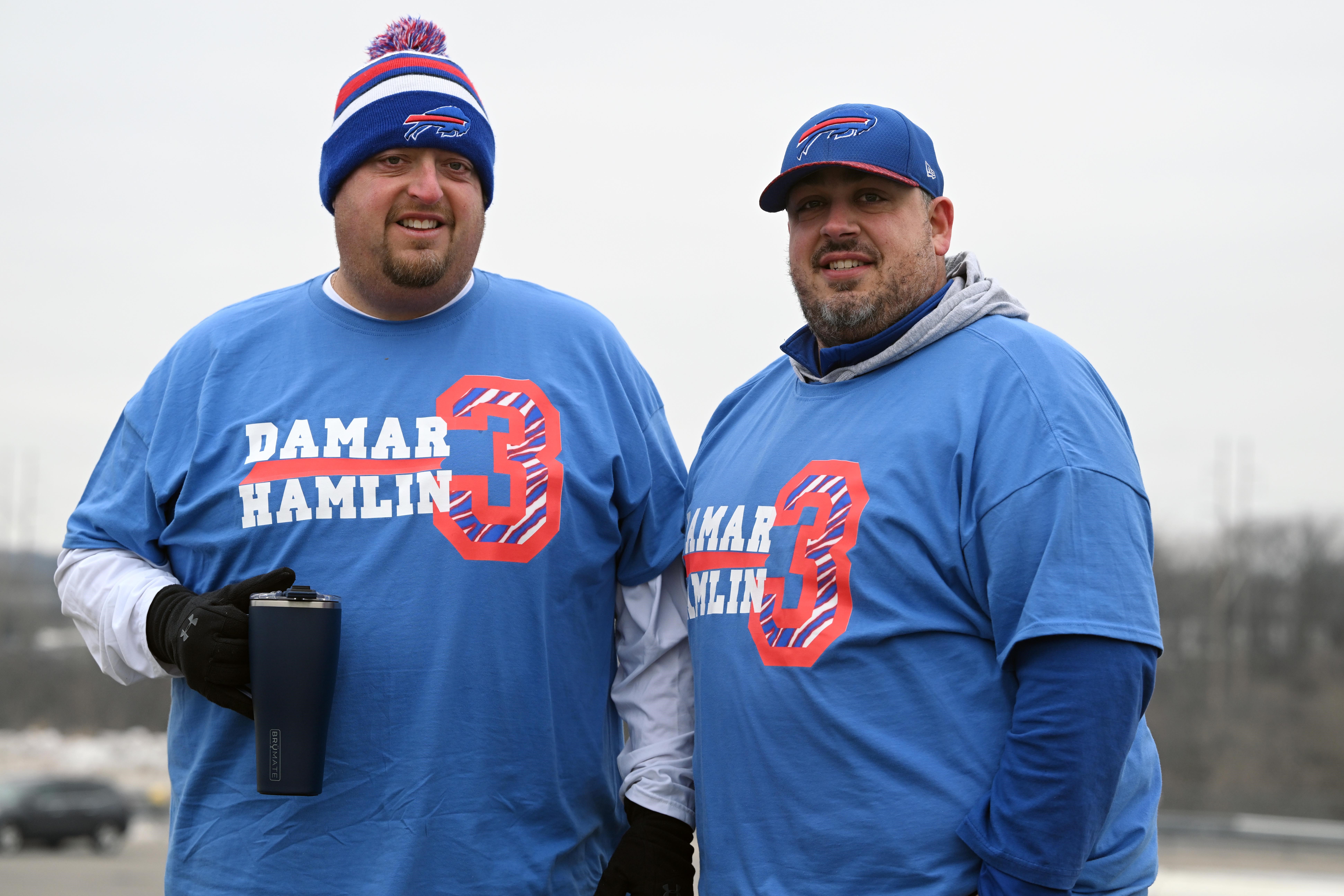 Tennessee Titans head coach Mike Vrabel wears a shirt honoring Buffalo  Bills player Damar Hamlin while watching players warm up before an NFL  football game against the Jacksonville Jaguars, Saturday, Jan. 7