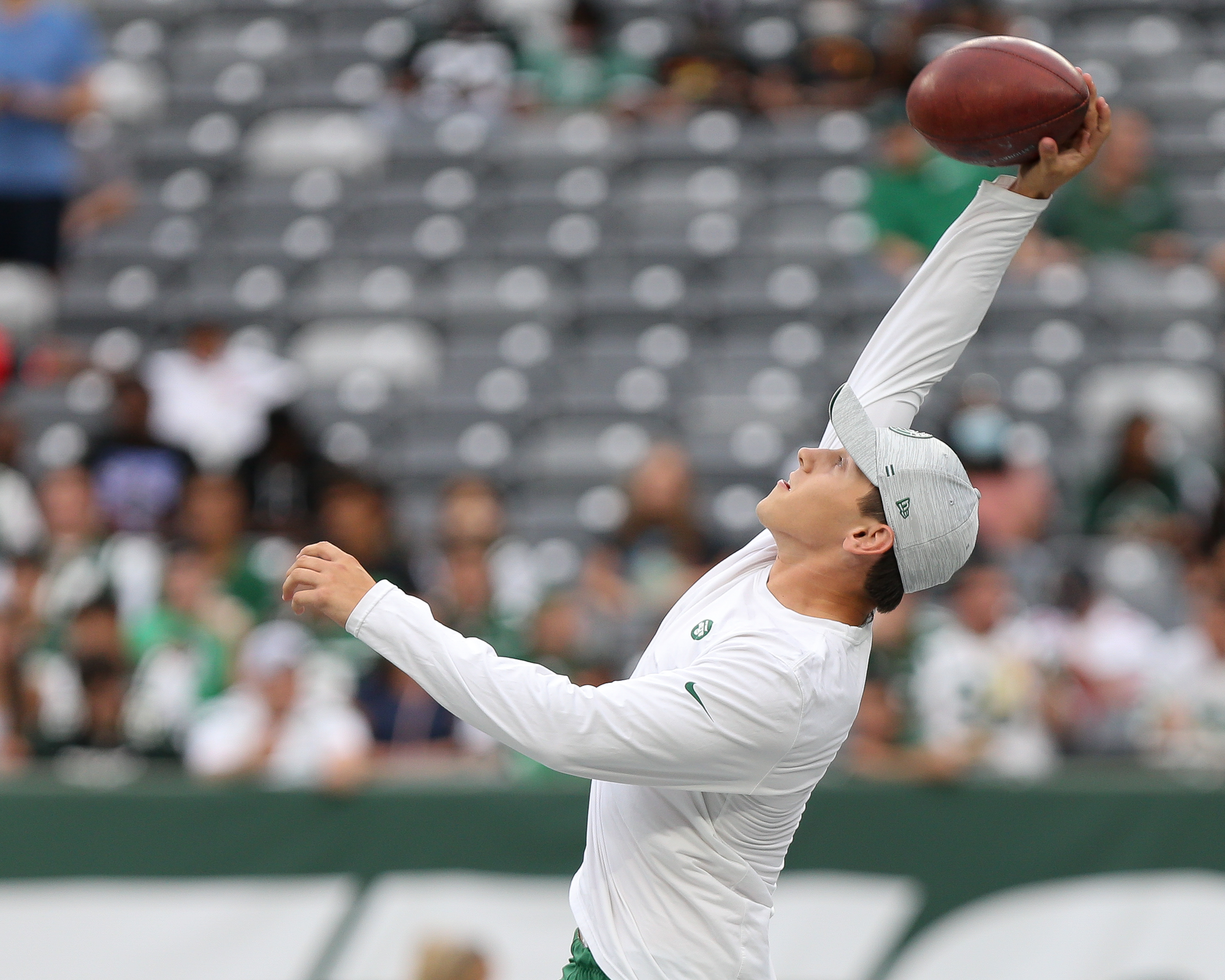 New York Jets punter Braden Mann (7) warms up on the field before