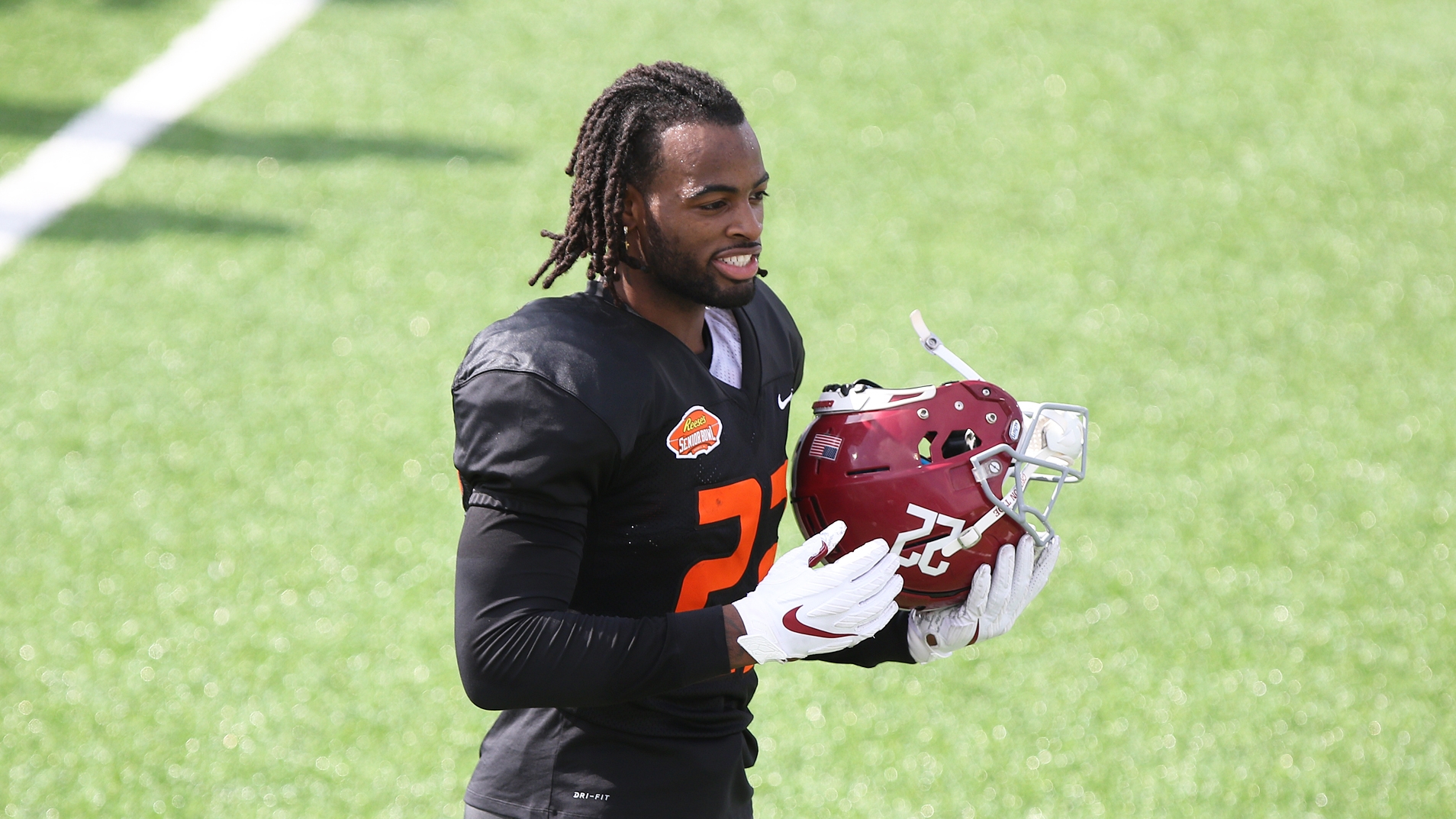 Najee Harris shows off upcoming clothing brand at Alabama's pro day