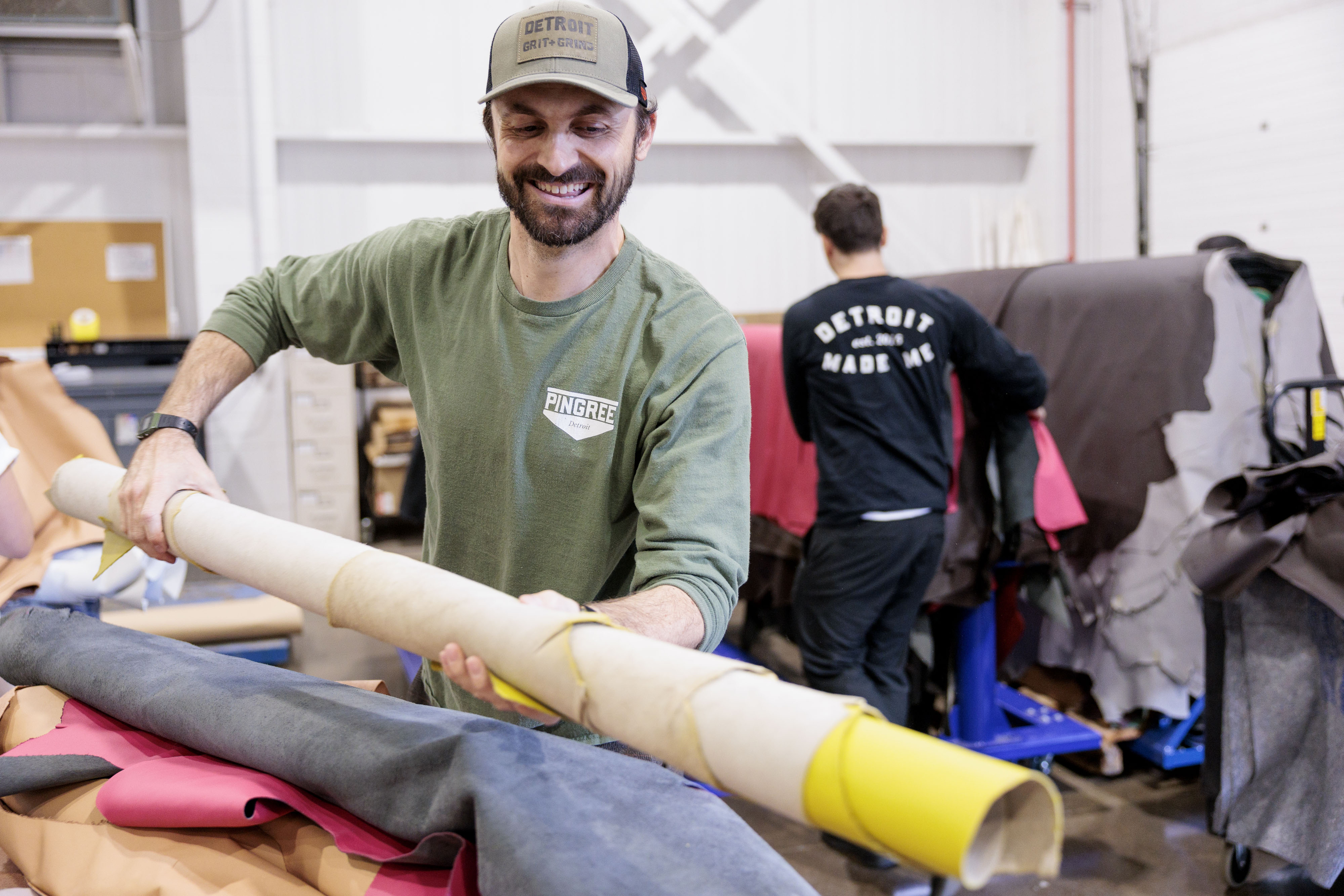 Pingree Detroit co-founder and CEO Jarrett Schlaff sorts through donated leather at Pangea in Rochester Hills on Monday, Oct. 6 2025.