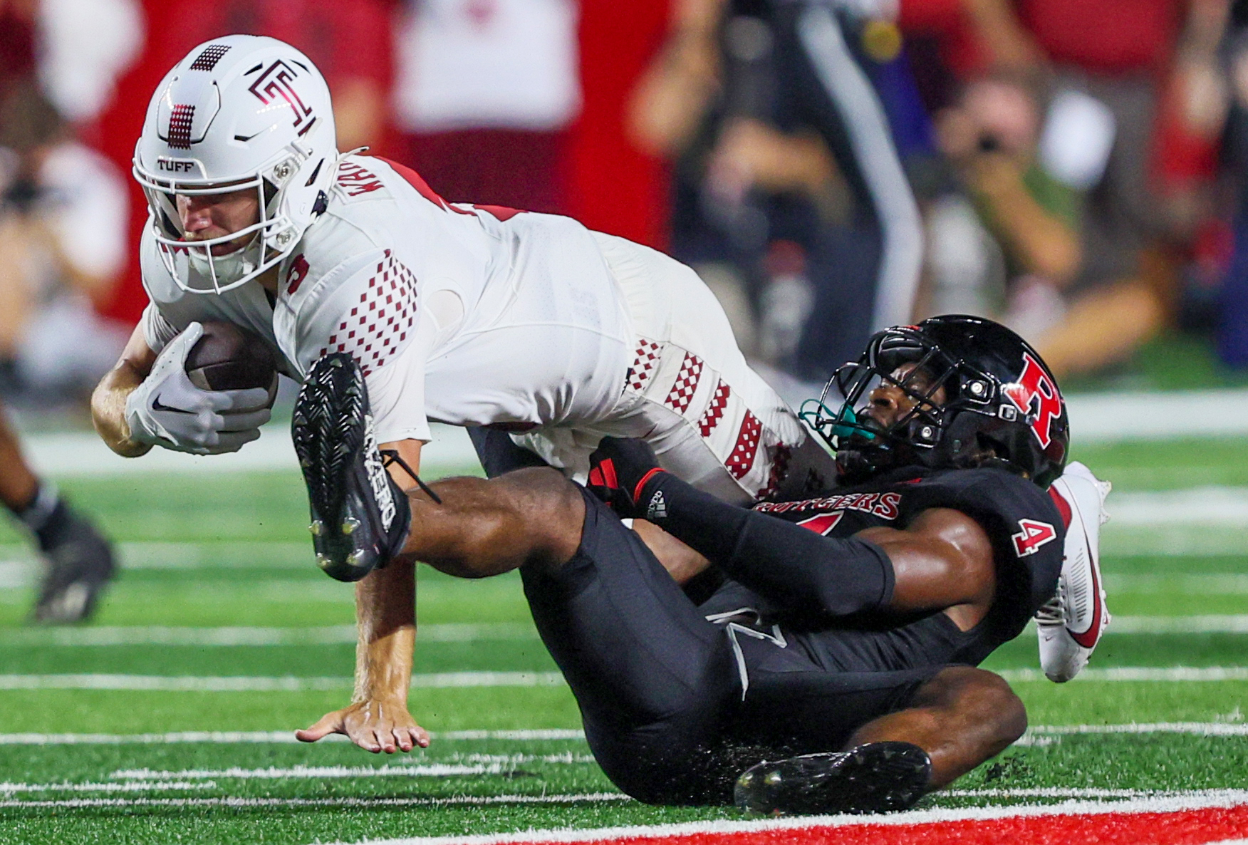 NCAA football Rutgers defeats Temple, 367