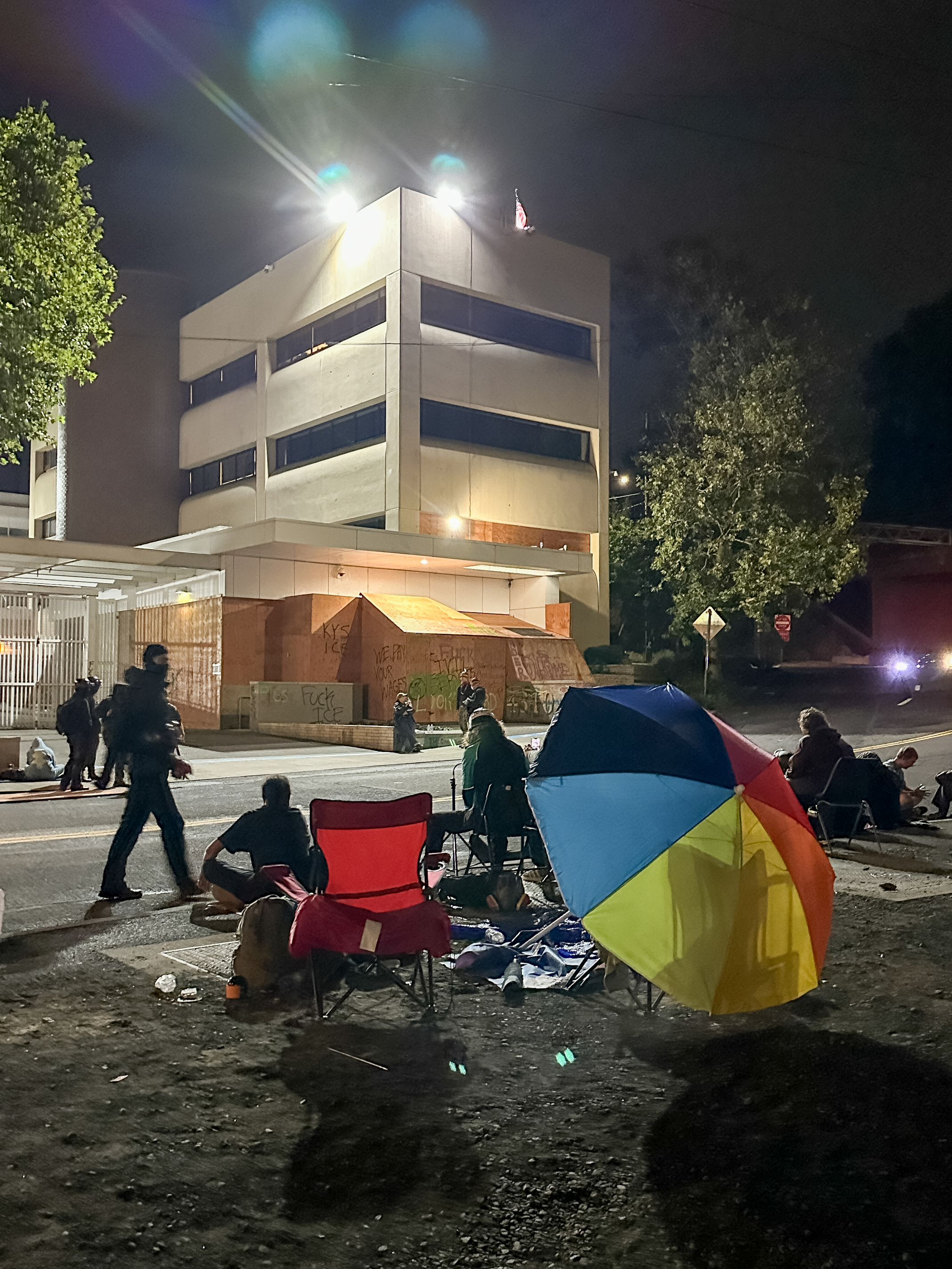 Protesters gather outside the boarded-up U.S. Immigration and Customs Enforcement building in South Portland on Monday, Sept. 8, 2025, days after President Donald Trump suggested federal intervention.