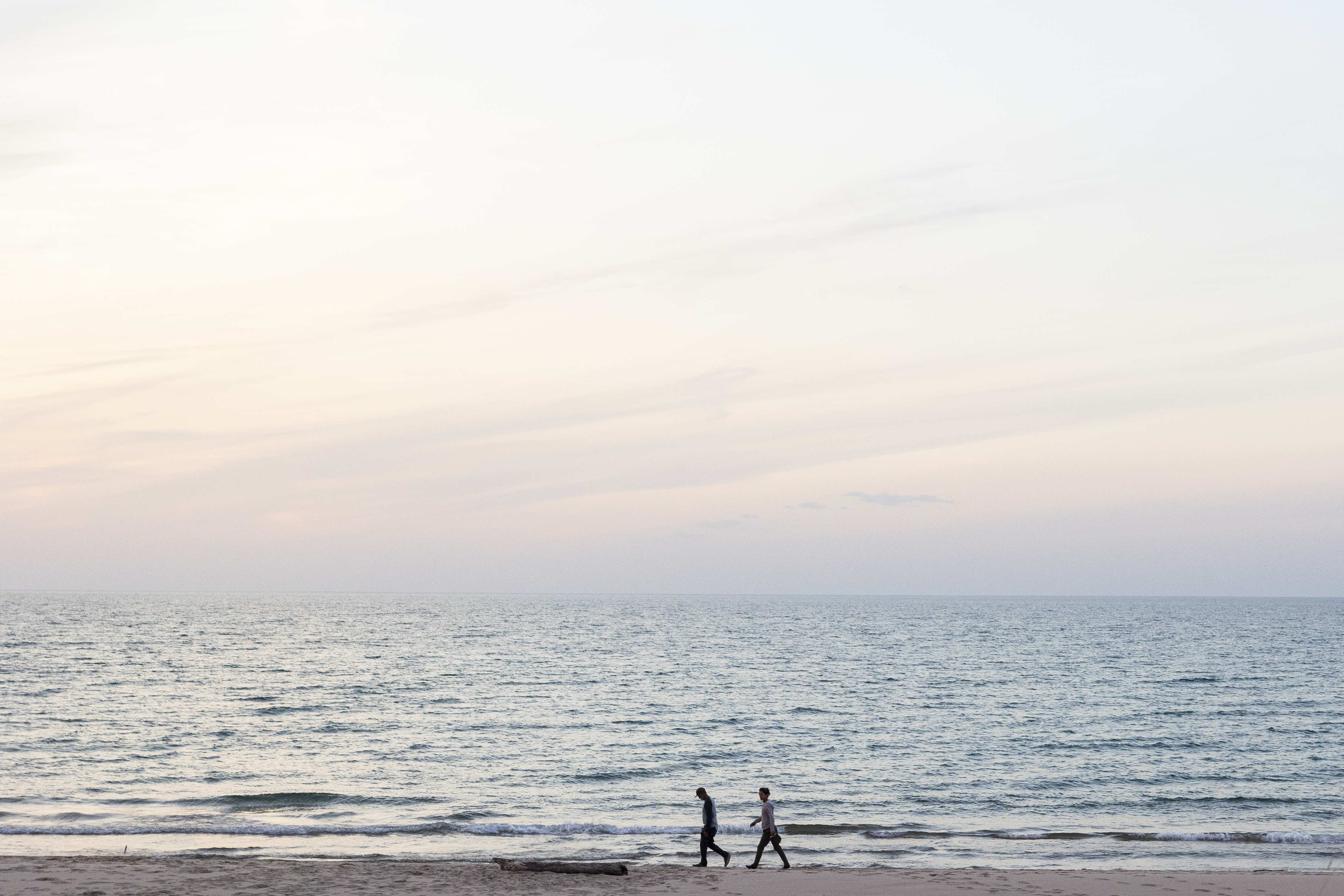 People walk along Lake Michigan at Nordhouse Dunes Wilderness Area in Mason County, Mich. on Friday, Oct. 11, 2024.  