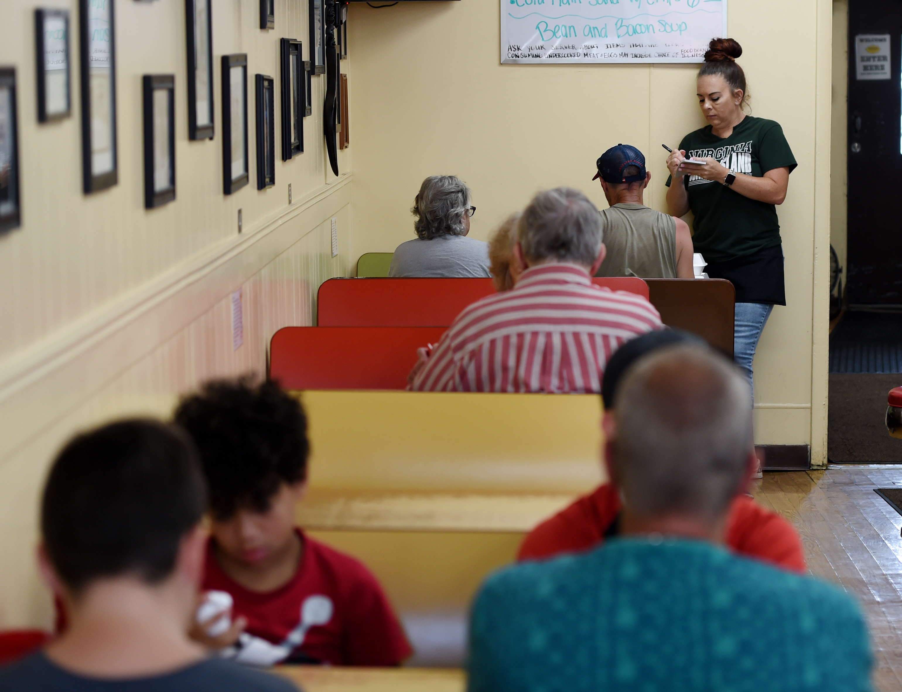 An order is taken at Virginia Coney Island, 649 E. Michigan Ave., on Monday, July 6, 2020. The restaurant has been serving the Jackson community since 1914.