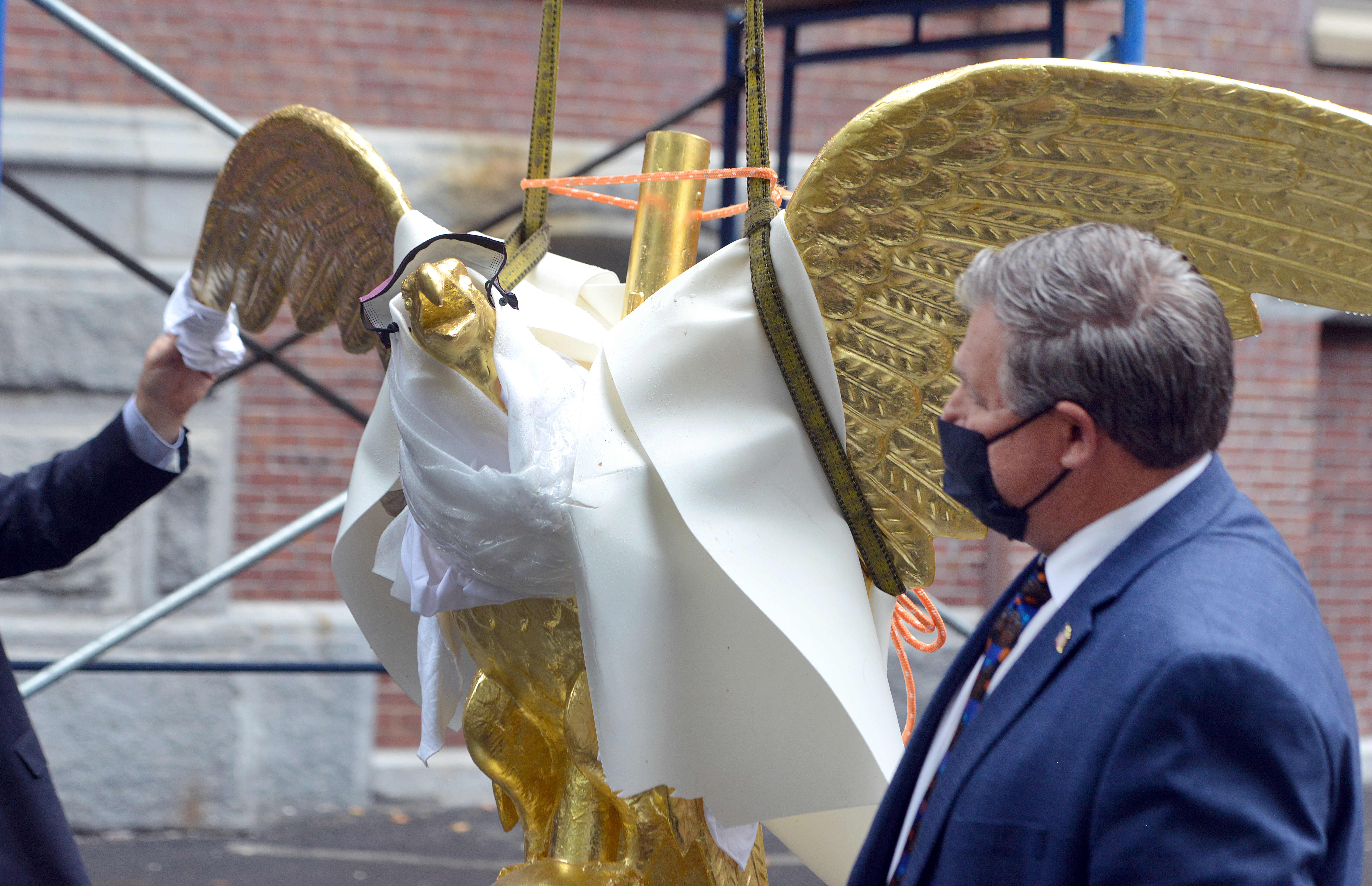 10/6/2020 -Chicopee-  Chicopee Mayor John Vieau stands next to a replica of  the "Chicopee Eagle Weathervane" before it was placed on top of the City Hall Clock Tower, now undergoing renovations. The original eagle will be on display in the City Hall auditorium once building renovations are complete.   (Don Treeger / The Republican)