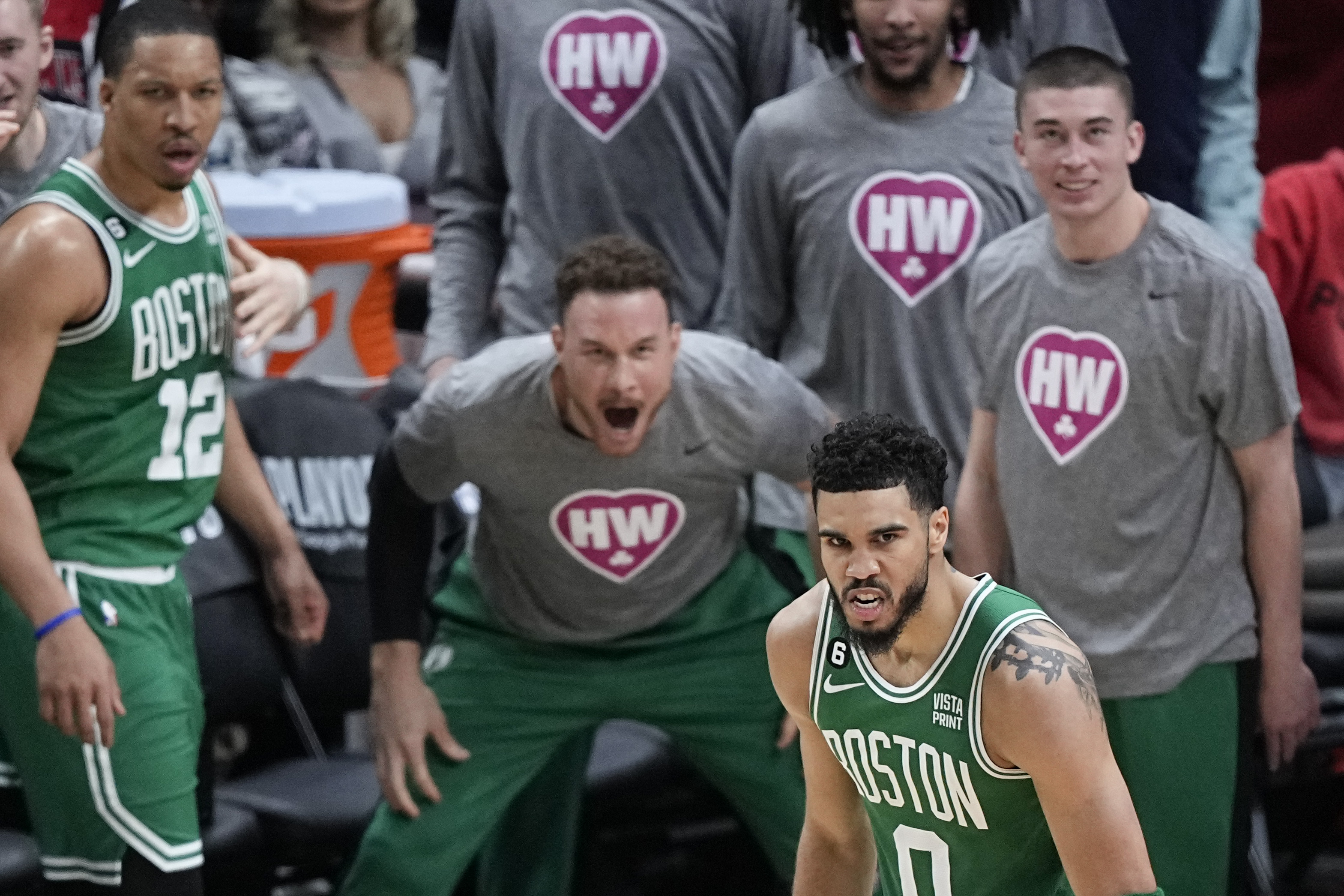 Boston Celtics' Jaylen Brown, right, goes up to shoot against Philadelphia  76ers' Paul Reed during the first half of Game 4 in an NBA basketball  Eastern Conference semifinals playoff series, Sunday, May