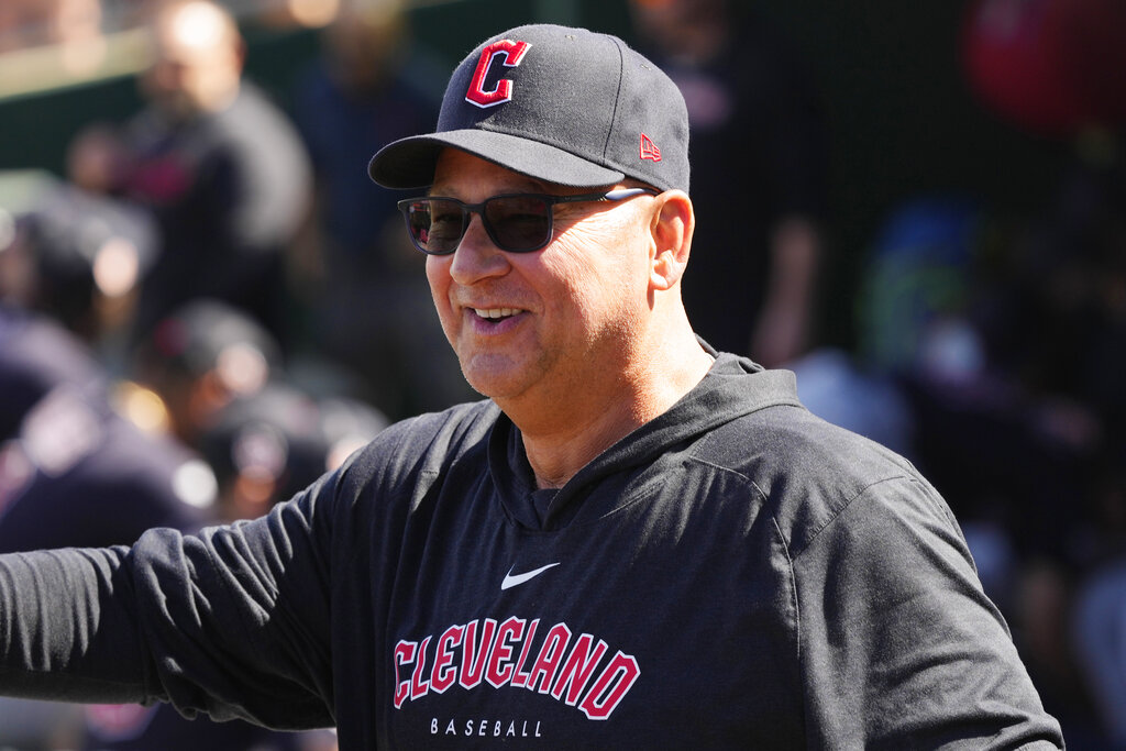 Cleveland Guardians manager Terry Francona, right, shakes hands with  Cincinnati Reds manager David Bell prior to a spring training baseball game  Saturday, Feb. 25, 2023, in Goodyear, Ariz. (AP Photo/Ross D. Franklin