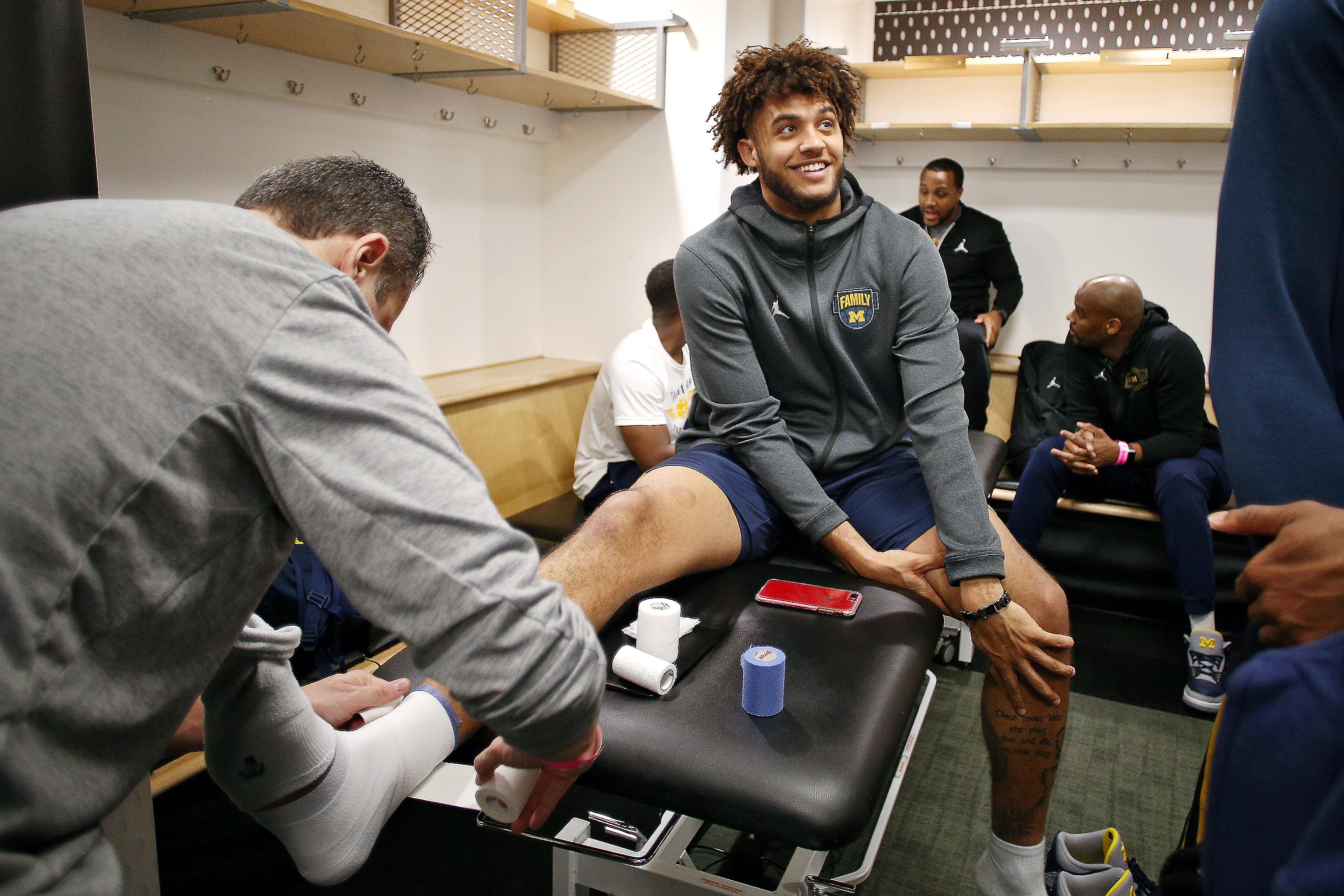 Why do some Michigan basketball players wear pink shoes mlive