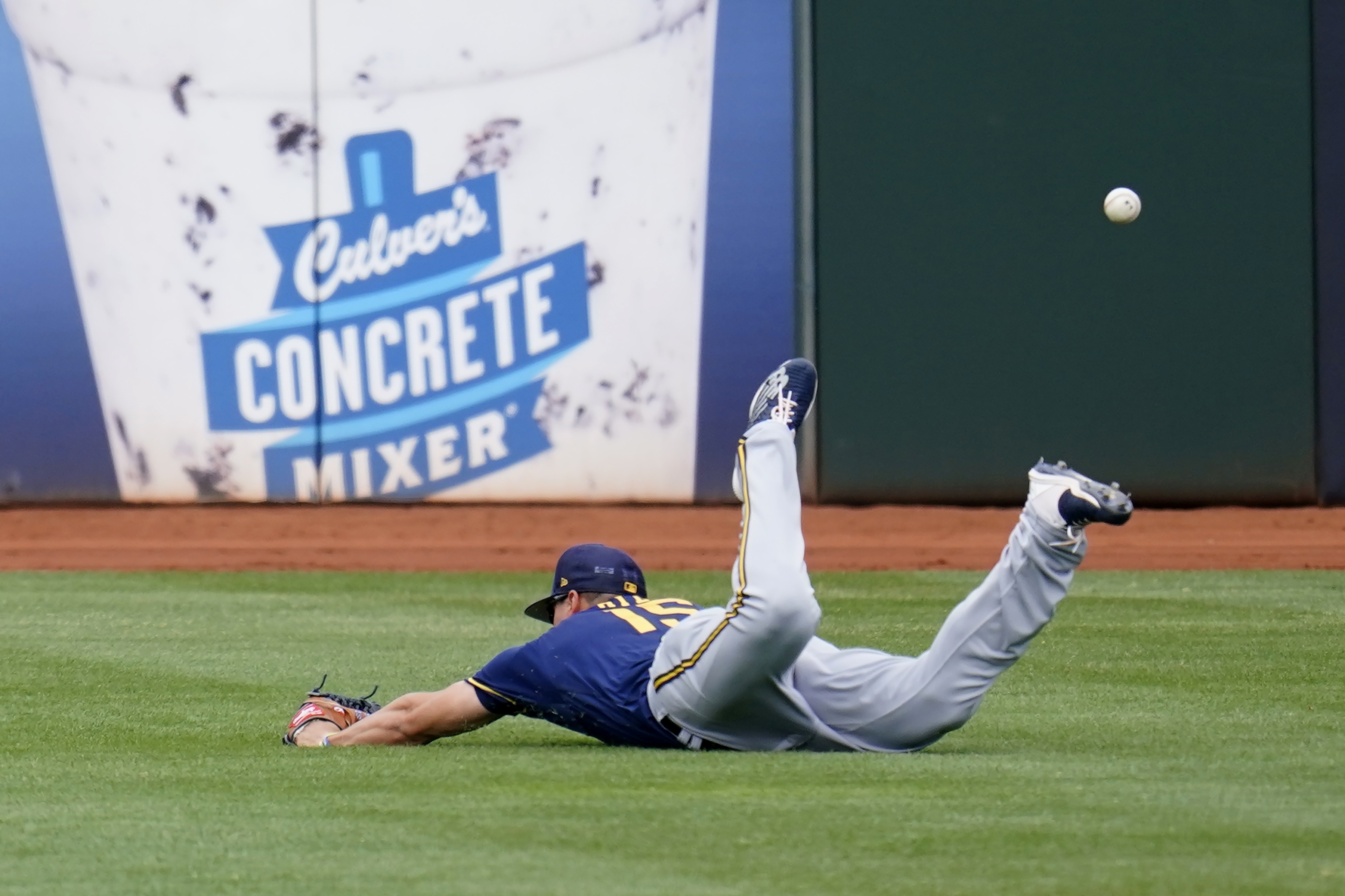 Milwaukee Brewers' Tyrone Taylor celebrates with Keston Hiura