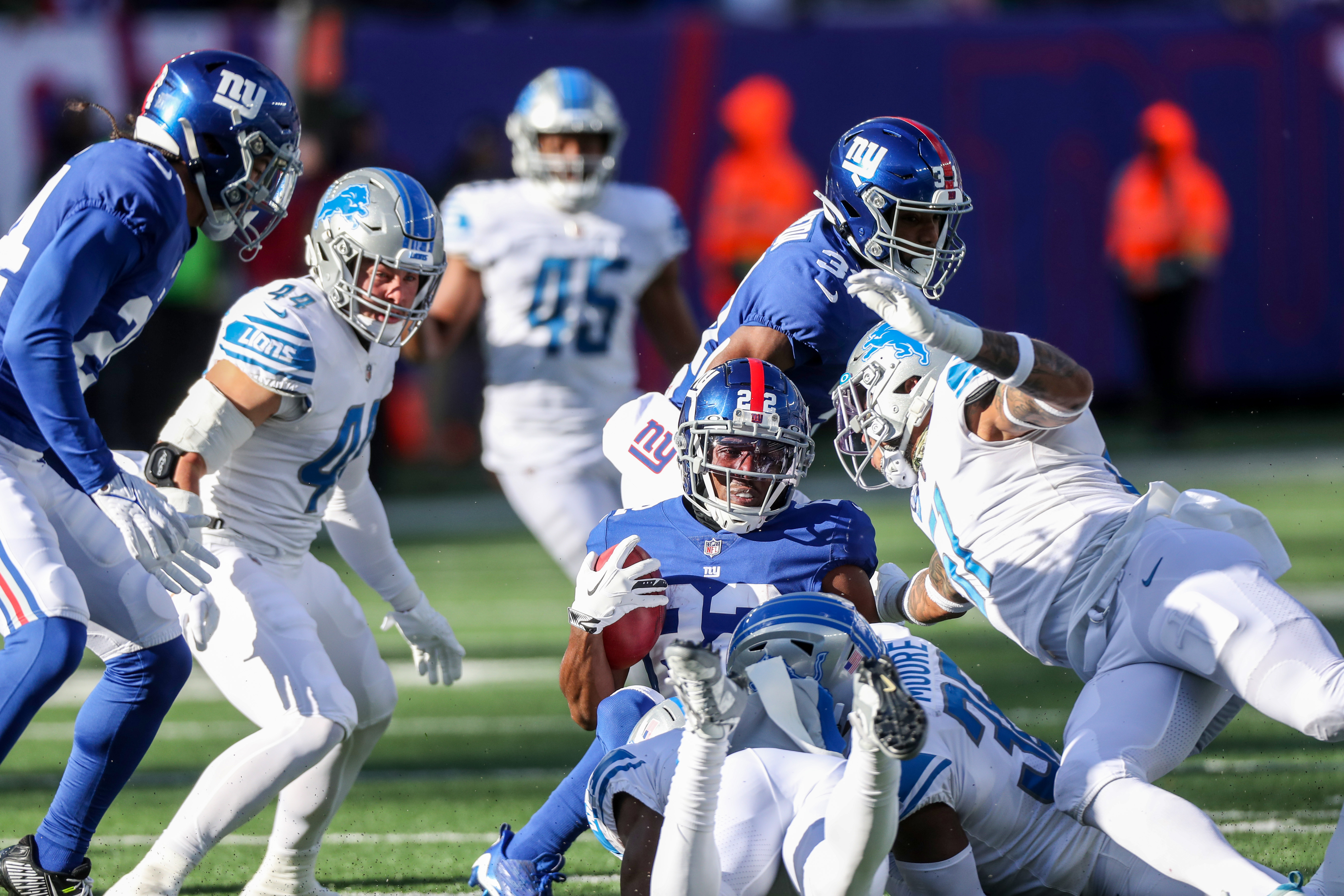 Cor'Dale Flott of the New York Giants hits D'Andre Swift of the