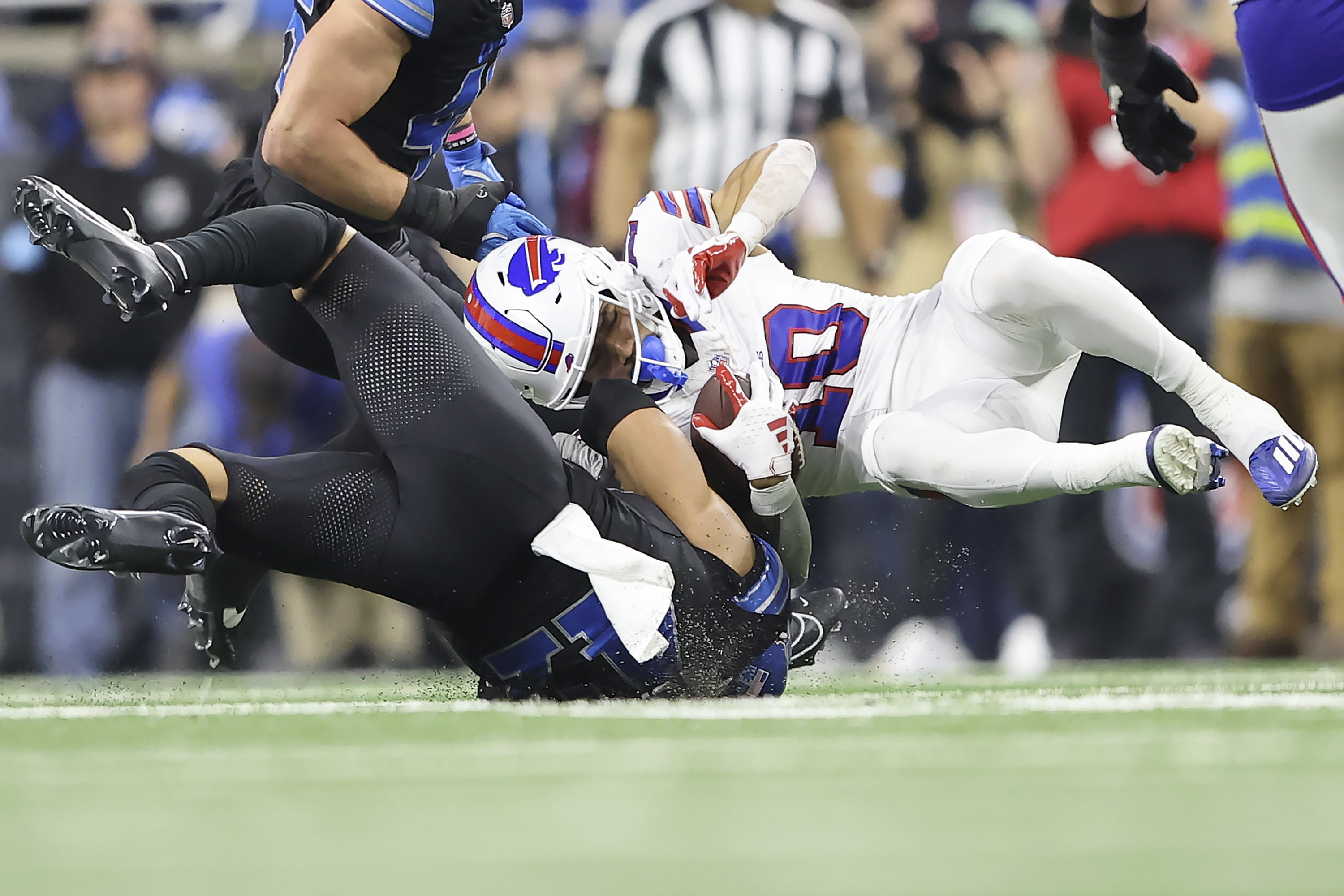 Buffalo Bills wide receiver Khalil Shakir, right, is tackled by Detroit Lions linebacker Ezekiel Turner during the first half of an NFL football game, Sunday, Dec. 15, 2024, in Detroit. (AP Photo/Rey Del Rio)