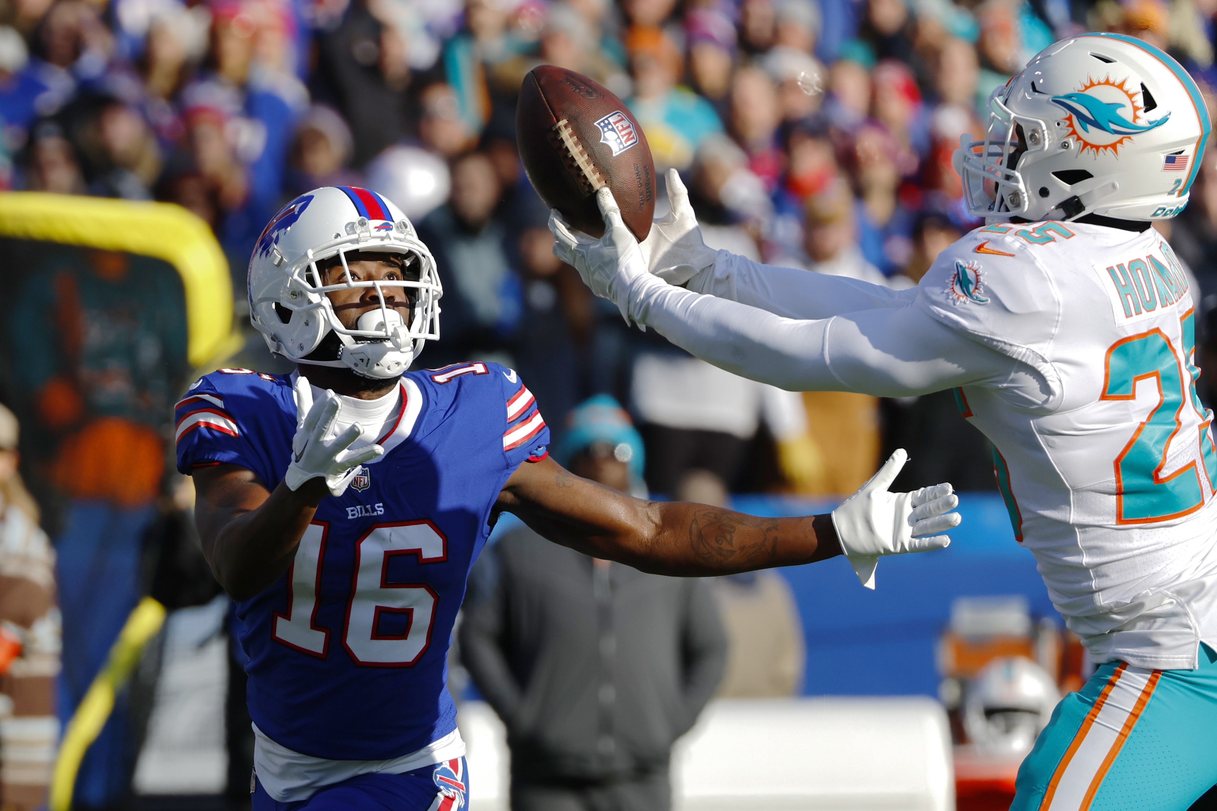 Buffalo Bills tight end Dawson Knox (88) catches a touchdown pass in front  of Miami Dolphins linebacker Jerome Baker (55) during an NFL wild-card  football game Sunday, Jan. 15, 2023, in Orchard