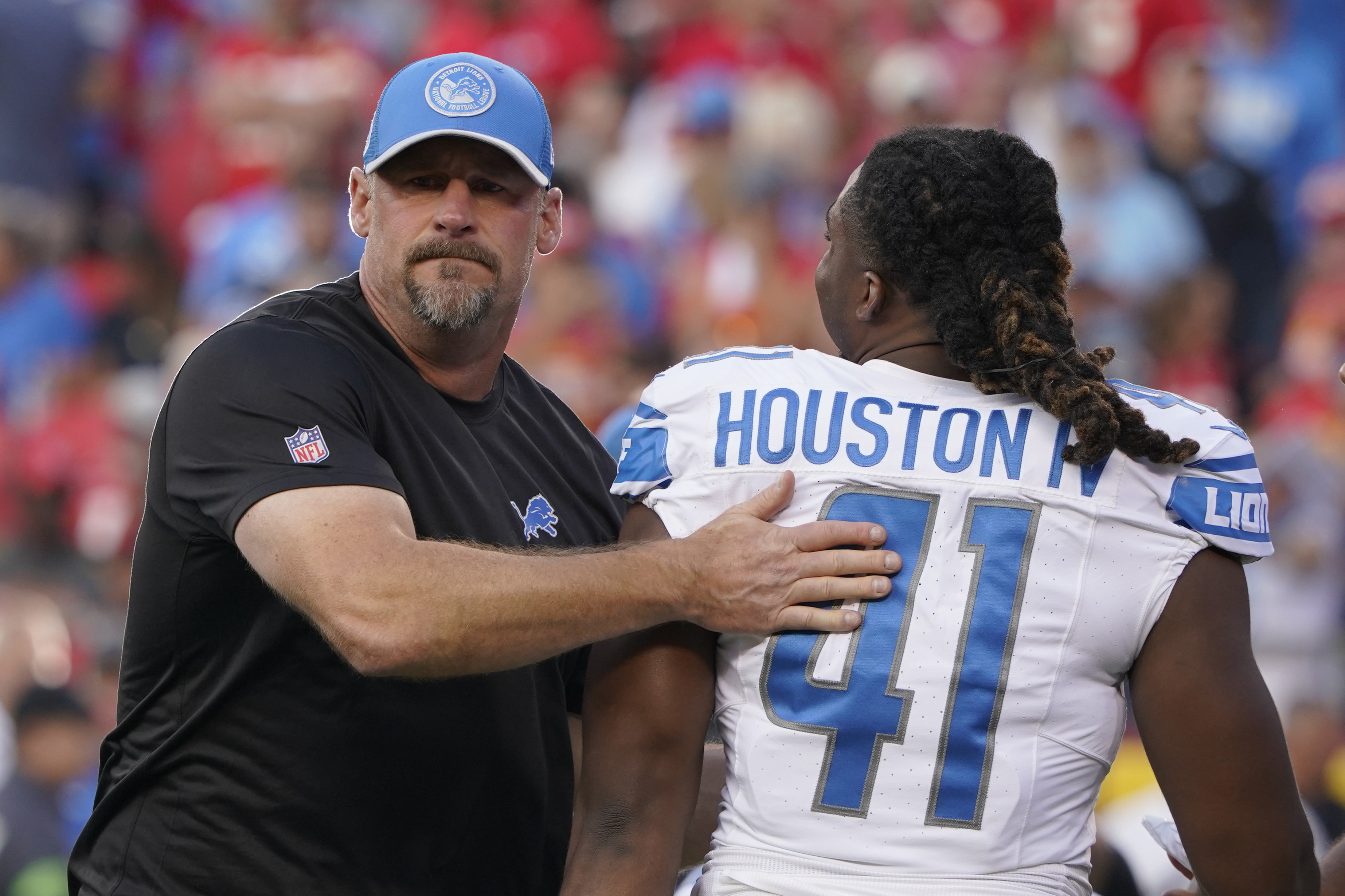 Detroit Lions linebacker James Houston, left, is blocked by