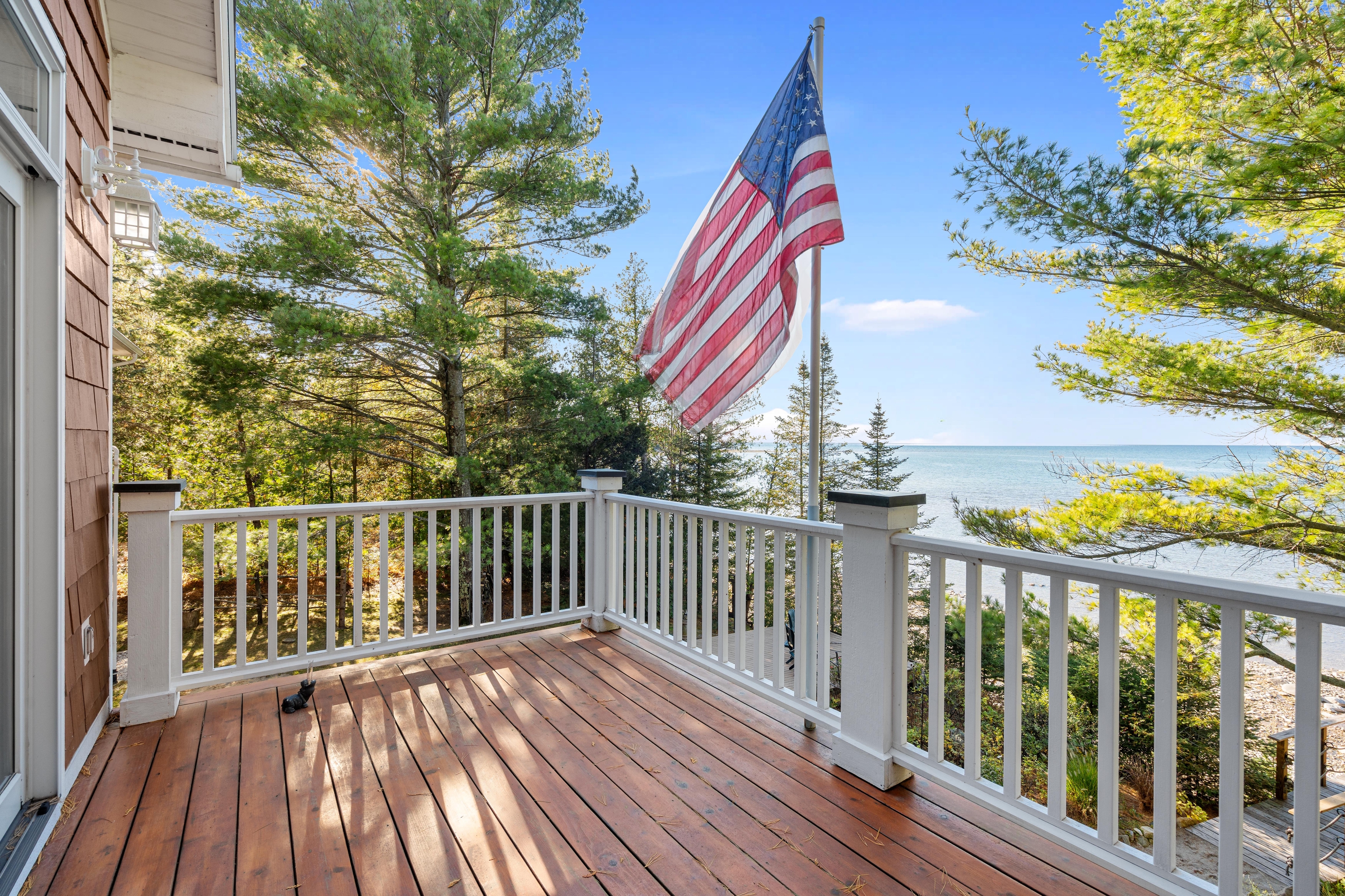 Exterior photographs of 4093 Lake Shore Drive in Charlevoix, this gem is listed at $2,099,900 through Berkshire Hathaway HomeServices Michigan Real Estate – Traverse City and The Crane Group with associate broker Johnny Crane and his brother, co-listing agent Matt Crane.